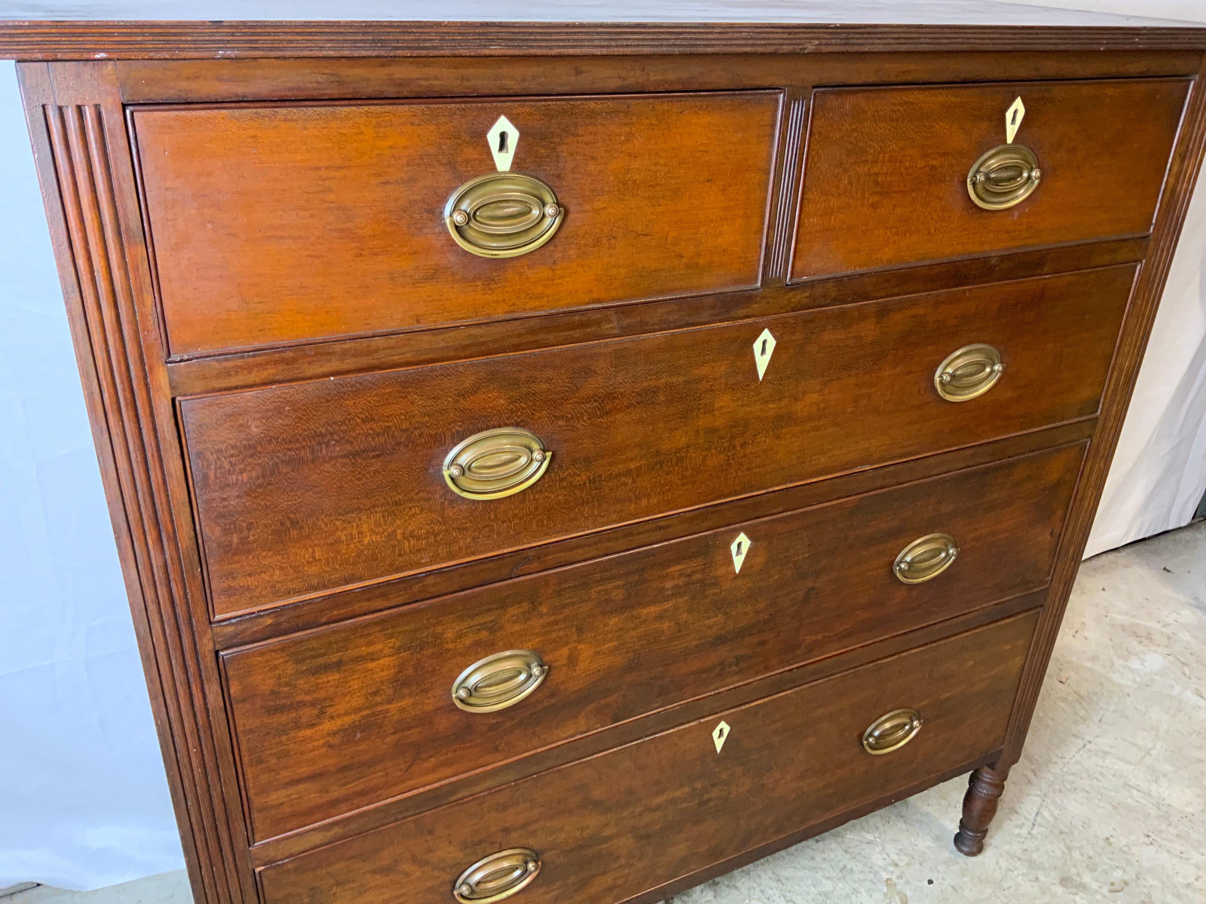 A very nice Sheraton Cherry two over three graduated drawer chest.  Probably Virginia or Pennsylvania with carved fluted corners. The case constructed of solid Cherry with Chestnut and yellow pine secondary woods.  Drawer bottoms are pegged into the