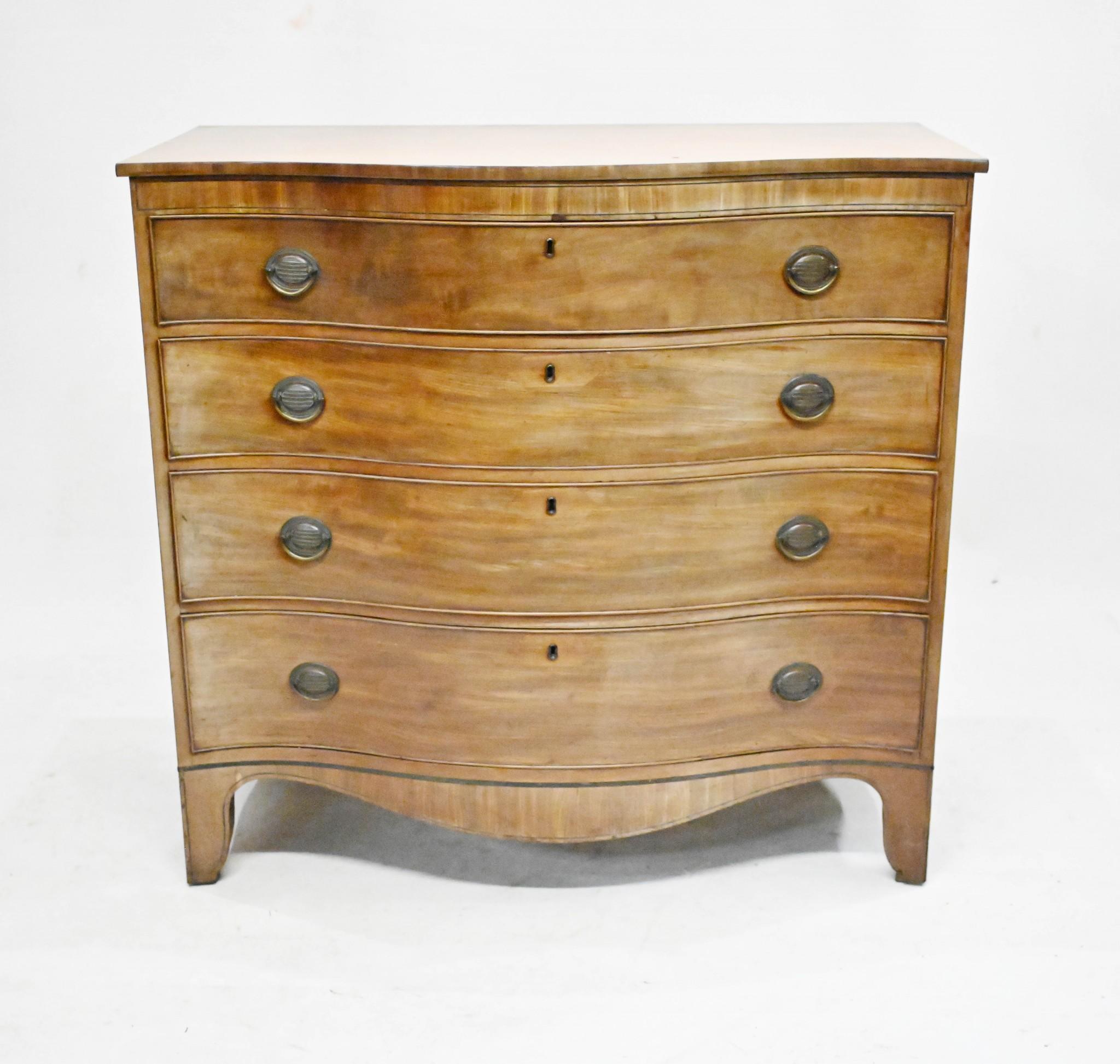 Gorgeous antique chest of drawers after Sheraton
Featues a serpentine form and four drawers so ample storge
We date this piece to circa 1810 and it's wonderful example of antique English furniture
Features original handles and bracket feet
Offered