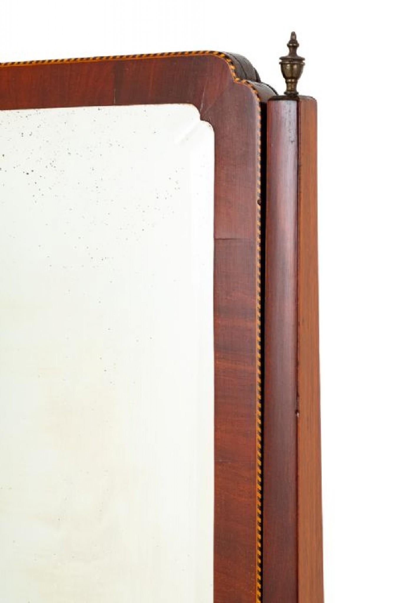 Elegant Sheraton Revival Mahogany Cheval Mirror.
Circa 1890
Standing Upon Shaped and Fluted Legs with Brass Castors.
The Square Uprights Feature Turned Finials.
The Whole of the Mirror Having Chequred Box Line Inlays.
The Mirror itself is