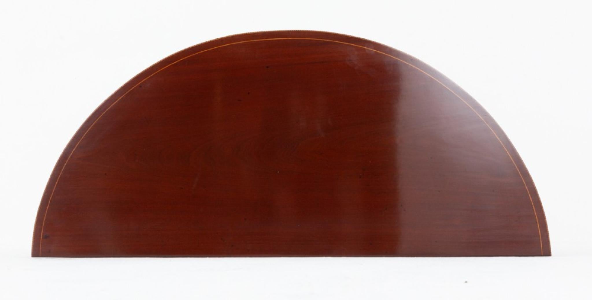 Mahogany Sheraton style demi lune table
Circa 1880
Will ship to anywhere in the world including US - please get in touch for shipping quote
This table is raised upon tapered legs with spade feet
The legs, frieze and top of the table having boxwood