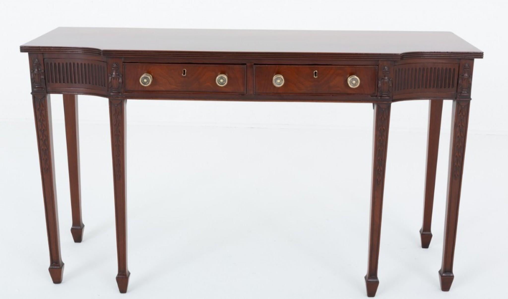 Sheraton Revival Mahogany Server.
19th Century 
This Server is Raised Upon 6 Tapered Legs with Spade Feet.
The Legs Having Carved decoration.
Featuring 2 Mahogany Lined Drawers Which Retain Their Original Brass Knobs.
The Shaped Top of the Server