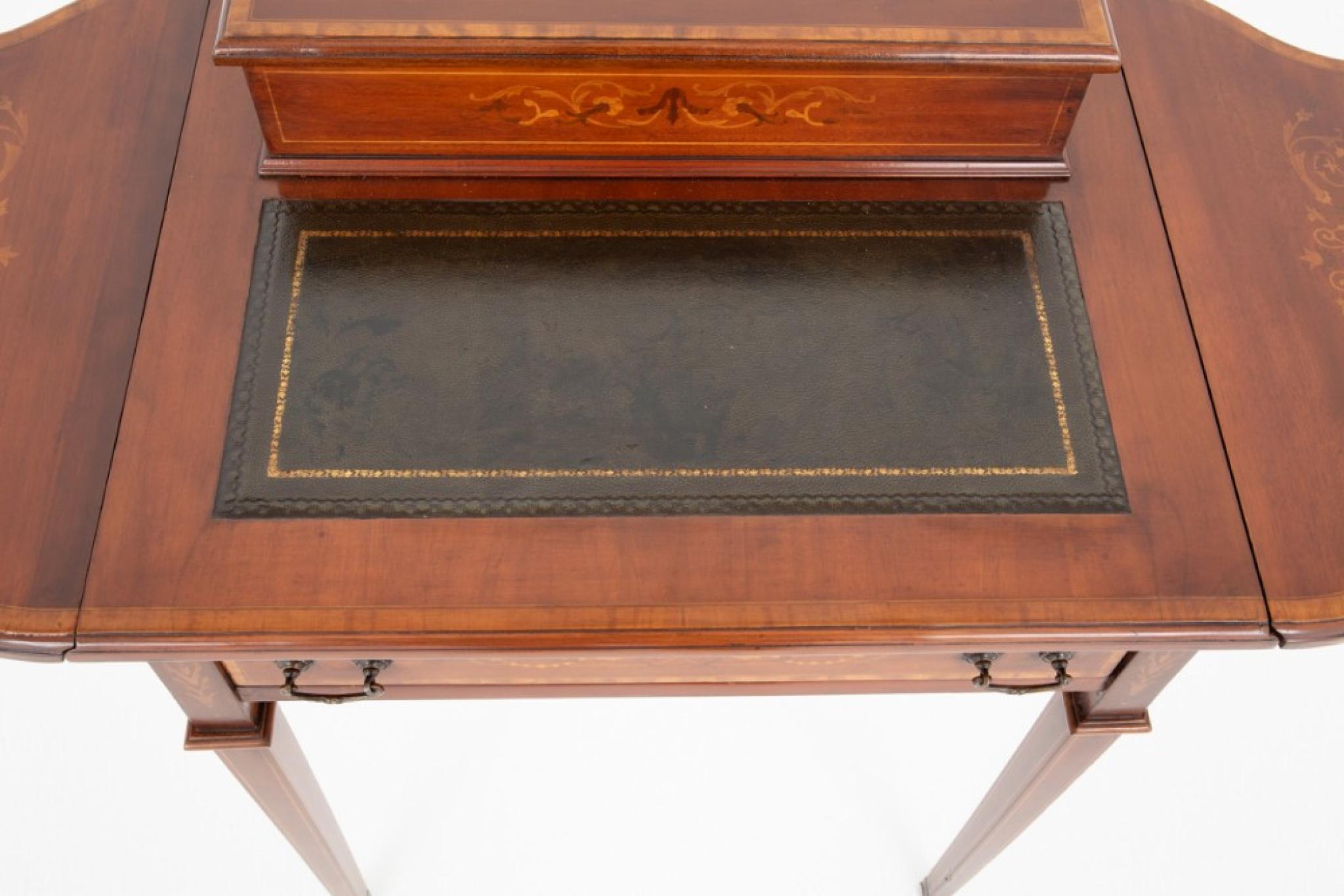 Pretty Sheraton revival mahogany ladies writing table
This elegant writing table is raised upon tapered legs
Having 2 drop flaps, a leather writing surface and a stationary box to the top
Circa 1920
Will ship to anywhere in the world - including US
