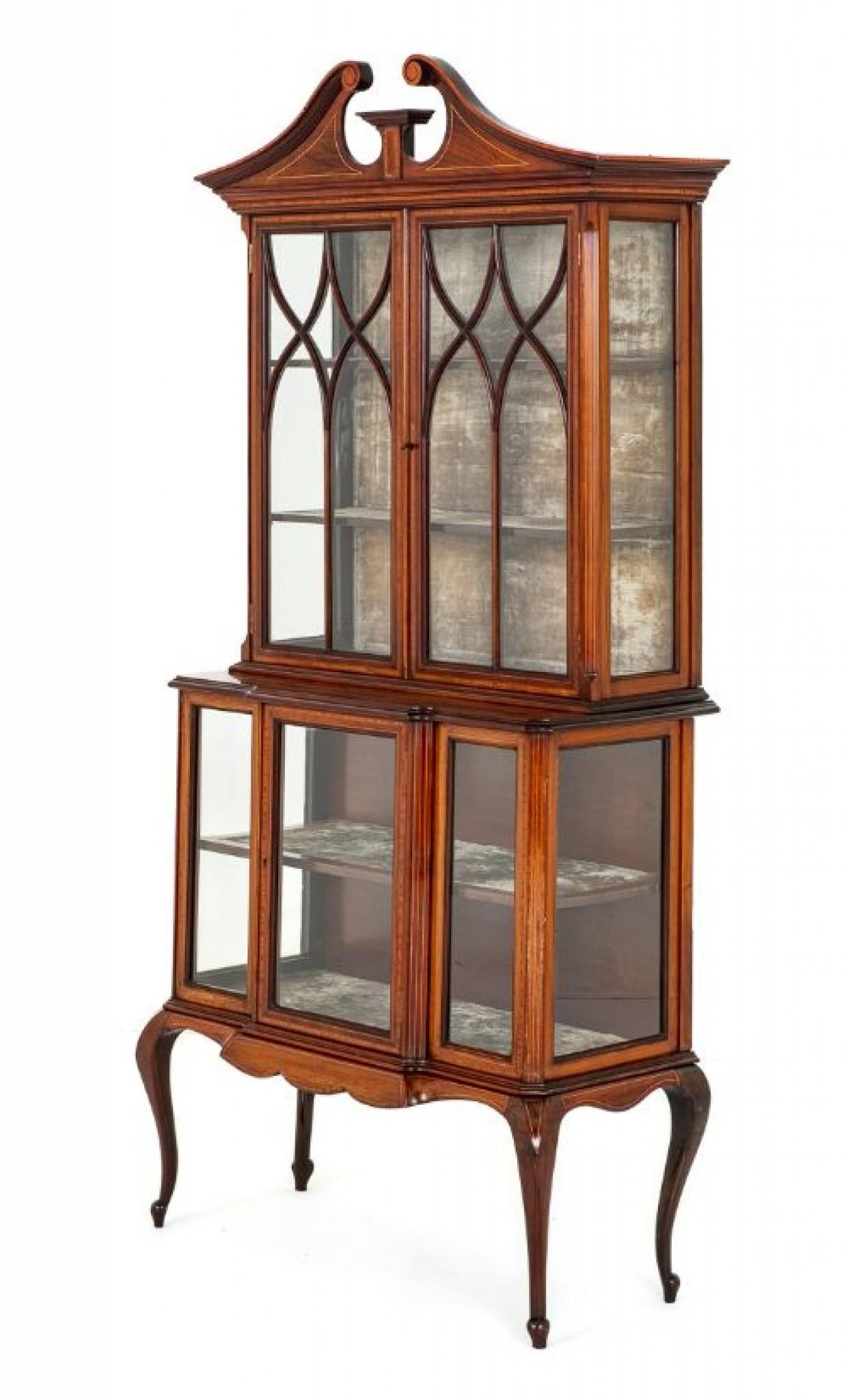 Sheraton Revival Mahogany Display Cabinet.
Circa 1890
This Elegant Cabinet Stands Upon Cabriole Legs With a Shaped Frieze.
The Lower Section Being of a Breakfront Form with 1 Door and Glazed Panels.
The Upper Section Having Astragal Glazing to the