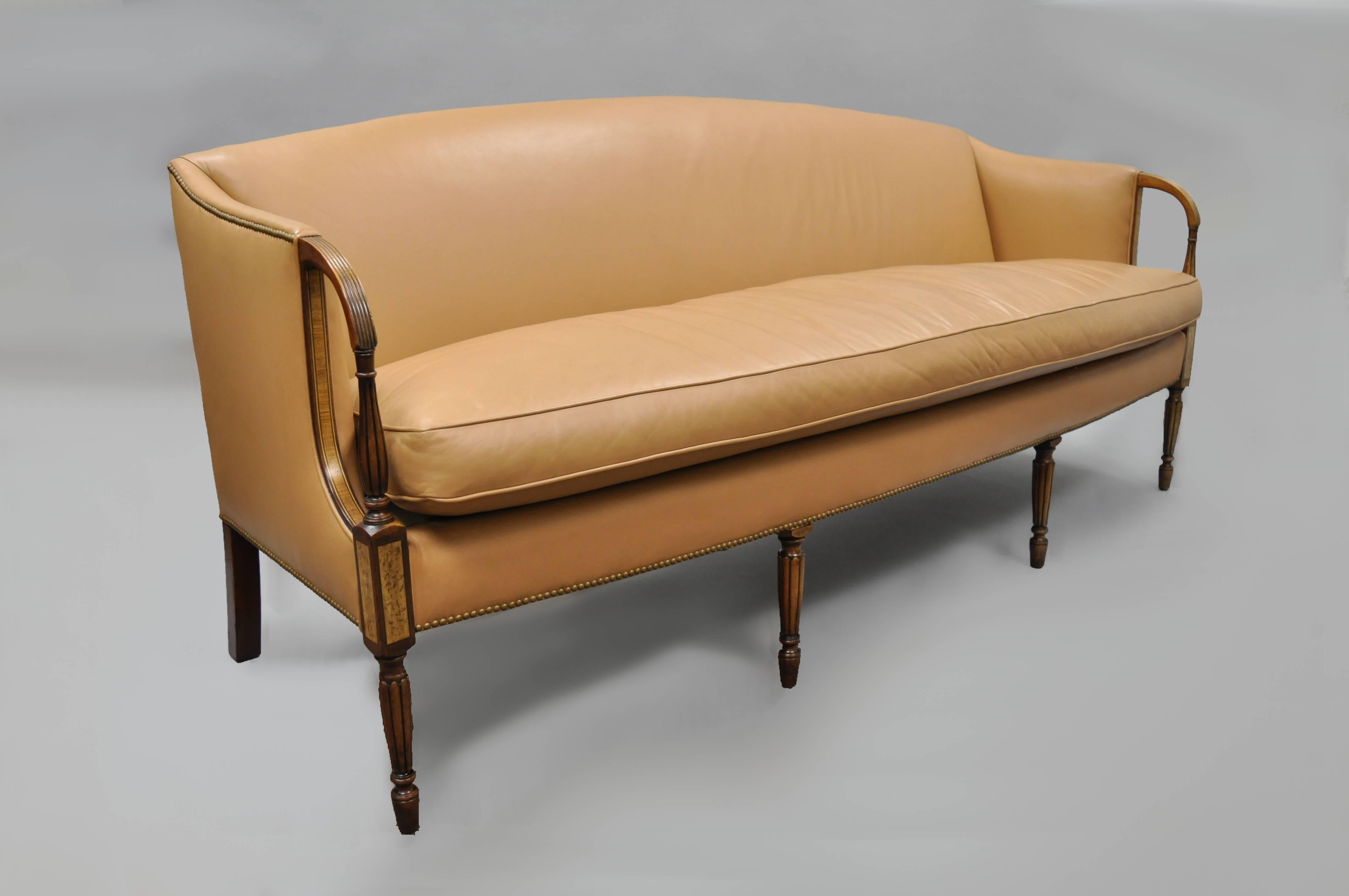 Late 20th Century Sheraton / Federal Style Caramel Leather Upholstered Sofa by Southwood. Item features solid wood construction, leather upholstery, tapered legs, nice inlay, banded details, quality American craftsmanship, branded Southwood in the