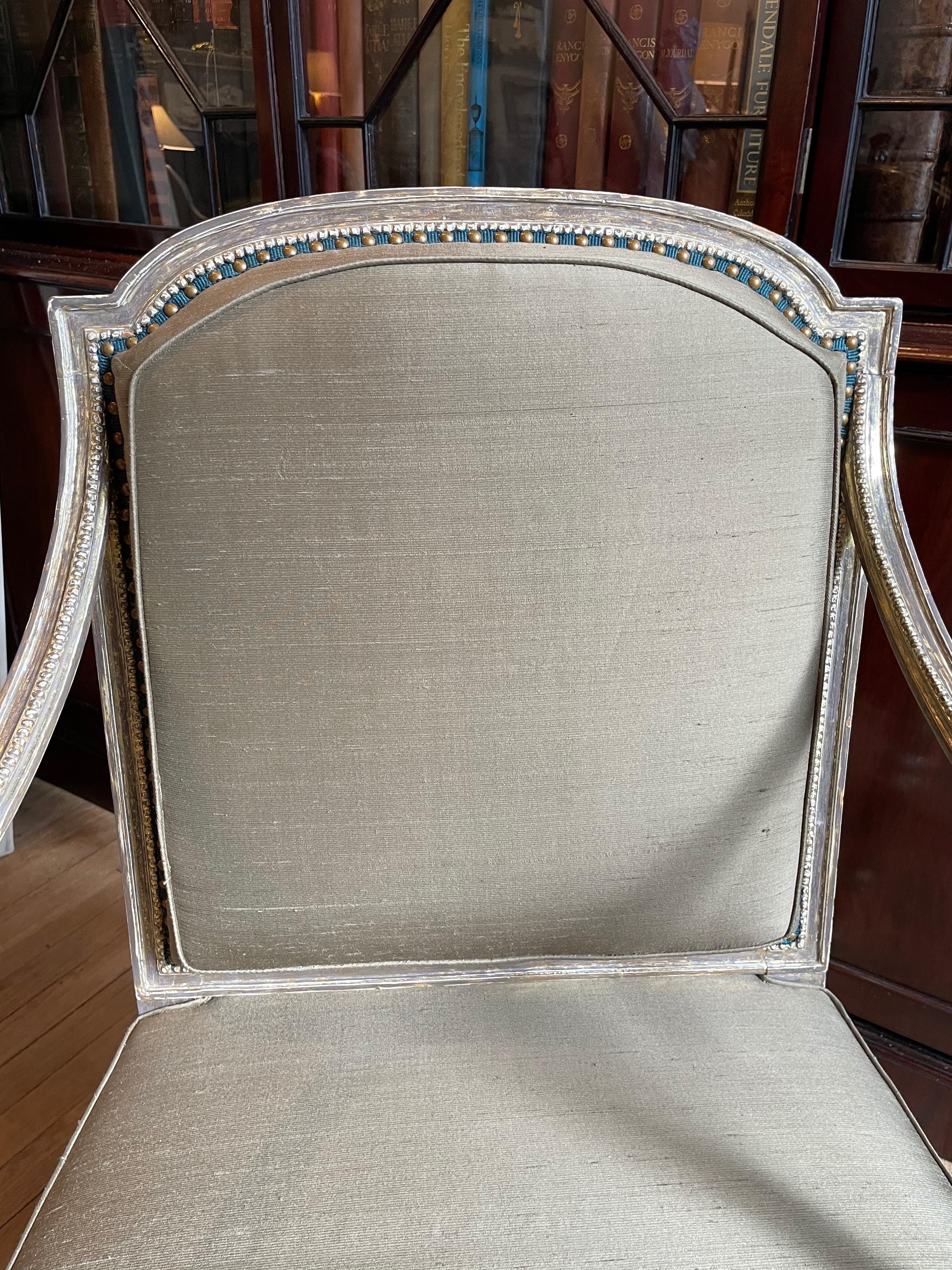 Sheraton giltwood armchair
English, circa 1785
Measures: Back height: 36 in. Width: 24 in. Depth: 23 in. Seat height: 17 in.

2199.
 