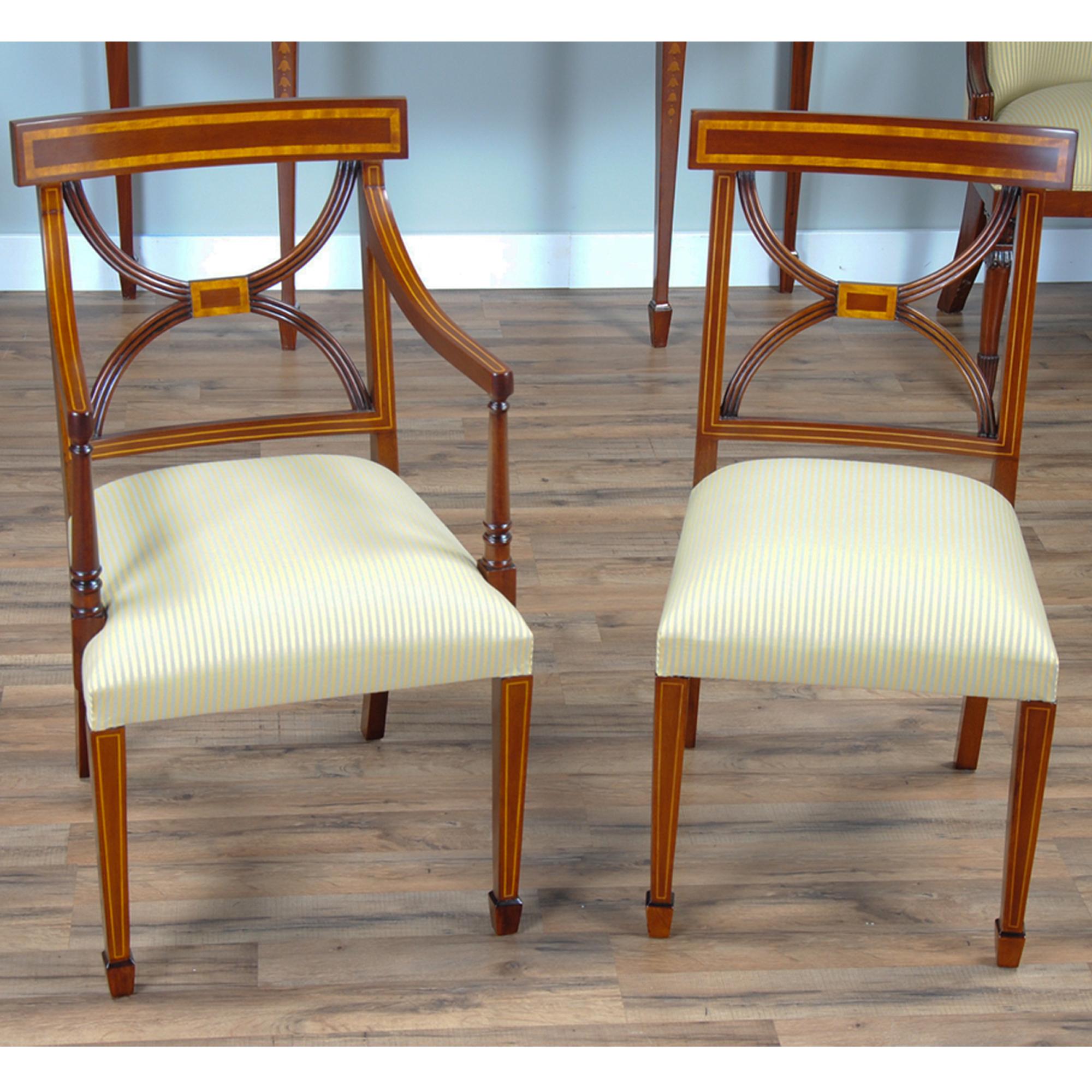 This set of 10 Sheraton Inlaid mahogany chairs consists of 2 arm chairs and 8 side chairs. Each chair is created from the finest grade of plantation grown solid mahogany and the finest available veneers. All of these materials come together to