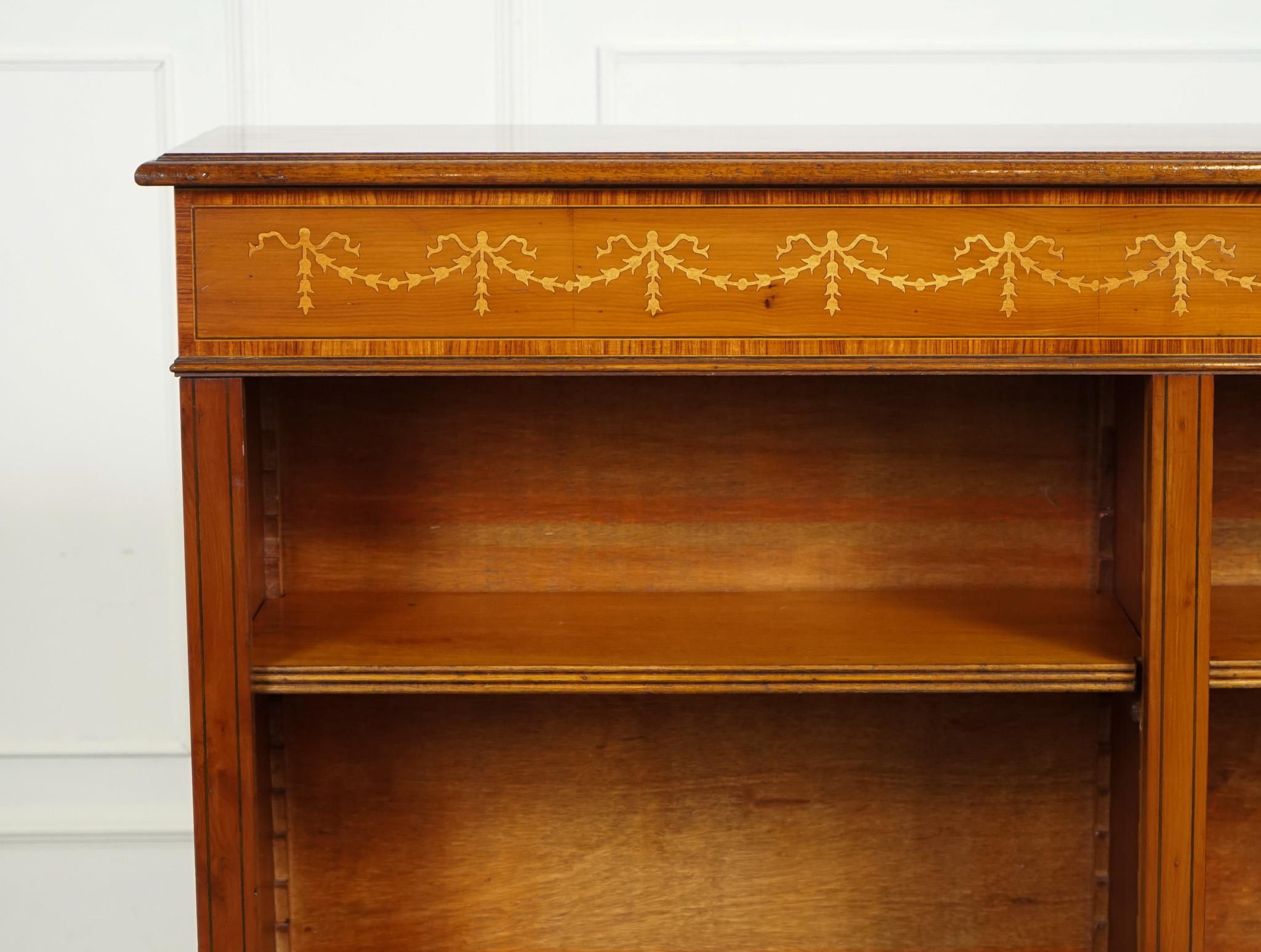
We are delighted to offer for sale this Beautiful Yew Wood Double Dwarf Open Bookcase.

A vintage Yew wood double dwarf open bookcase with Sheraton inlay on the front is a classic and sophisticated piece of furniture that exudes elegance and charm.