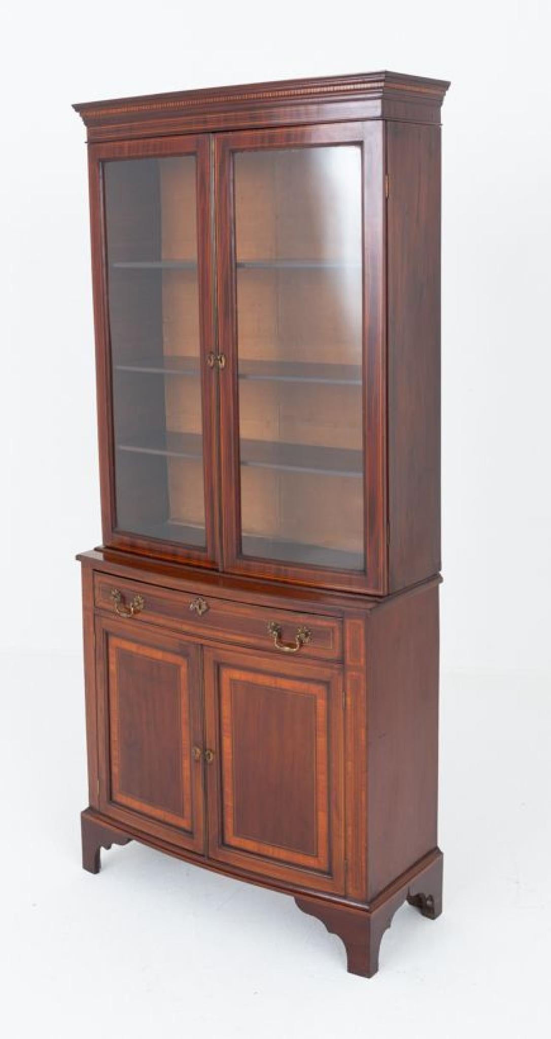 Sheraton Revival bow fronted library bookcase.
Circa 1900
The bookcase stands upon bracket feet
Will ship to anywhere in the world including US - please get in touch for a shipping quote
The lower section having 2 doors and 1 oak lined drawer
The