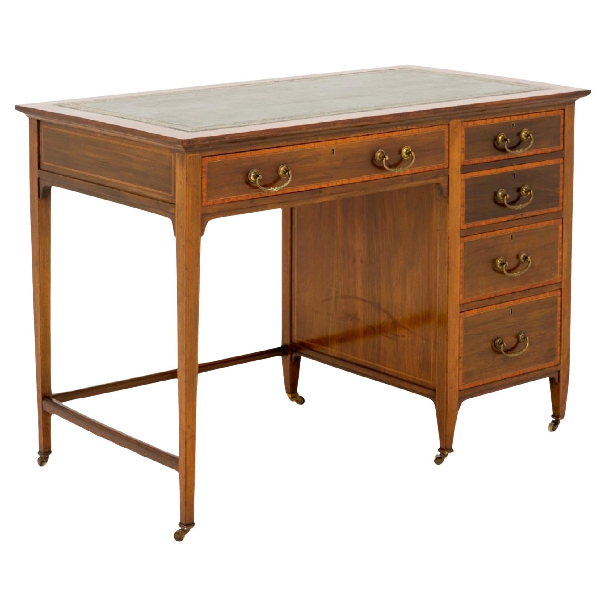 Very Pretty Sheraton Revival Mahogany Desk.
Standing on original Brass castors.
Circa 1890
The Mahogany Lined Drawers (note the fine dovetails) having satinwood crossbanding and retain the original handles and locks.
The top featuring a leather