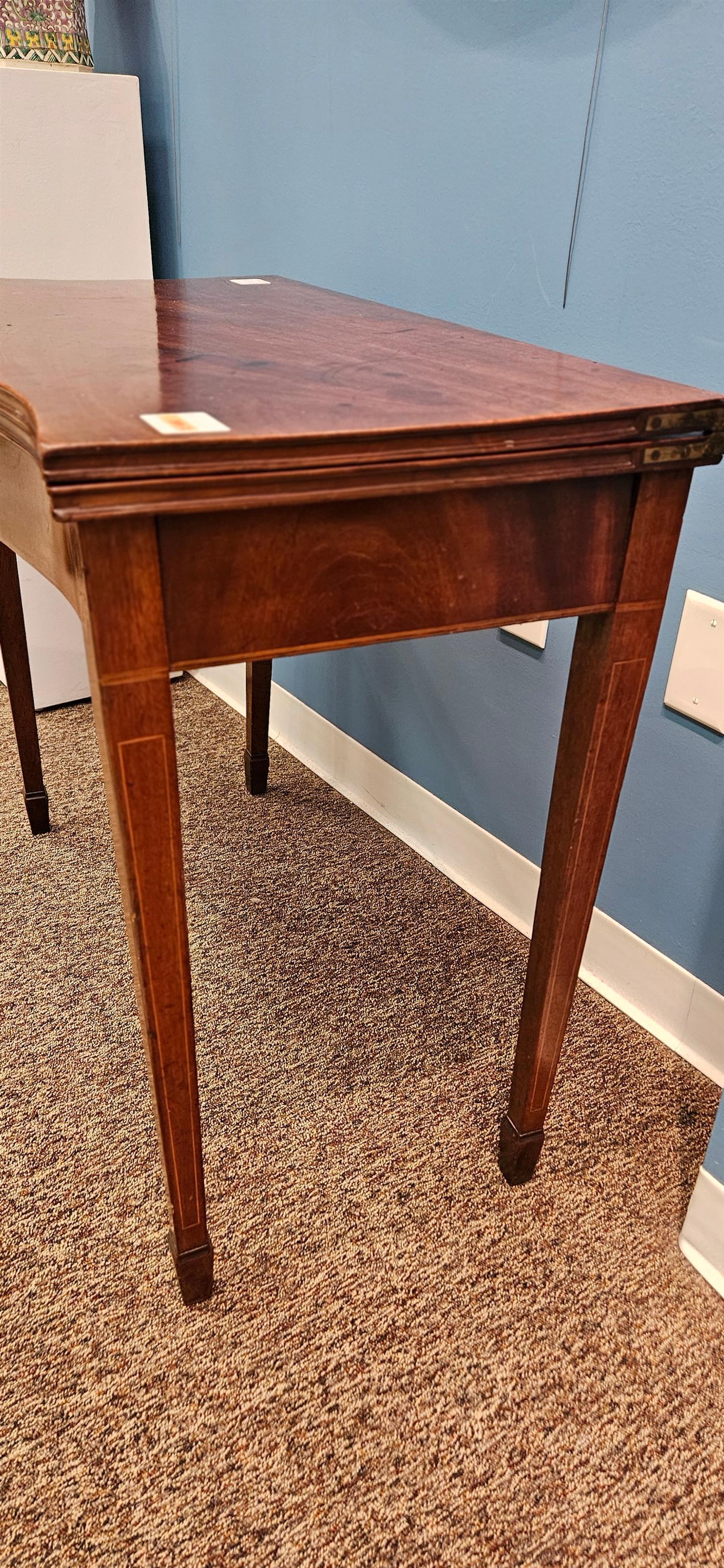Sheraton Mahogany Games Table circa 1800, serpentine front, hinged top, leaf and line inlays