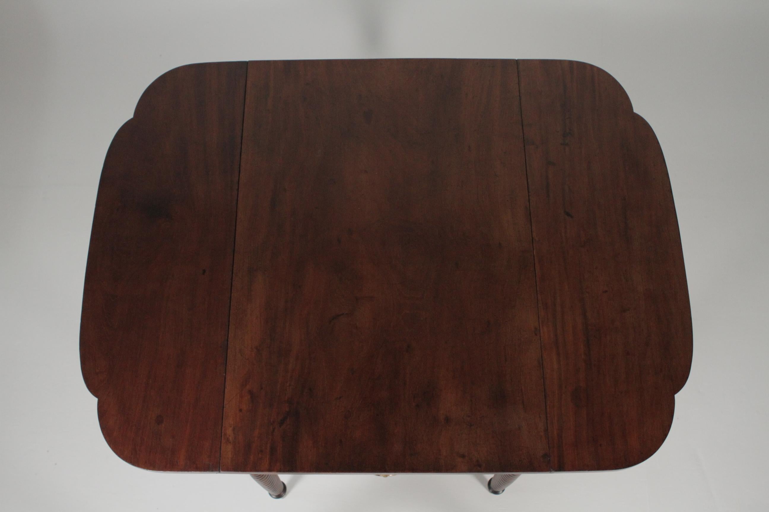 Sheraton mahogany twist leg drop-leaf table with one drawer. Dimensions: 38” D x 26.5” W, circa 1820-1840.
50.5 W open x 29” H.