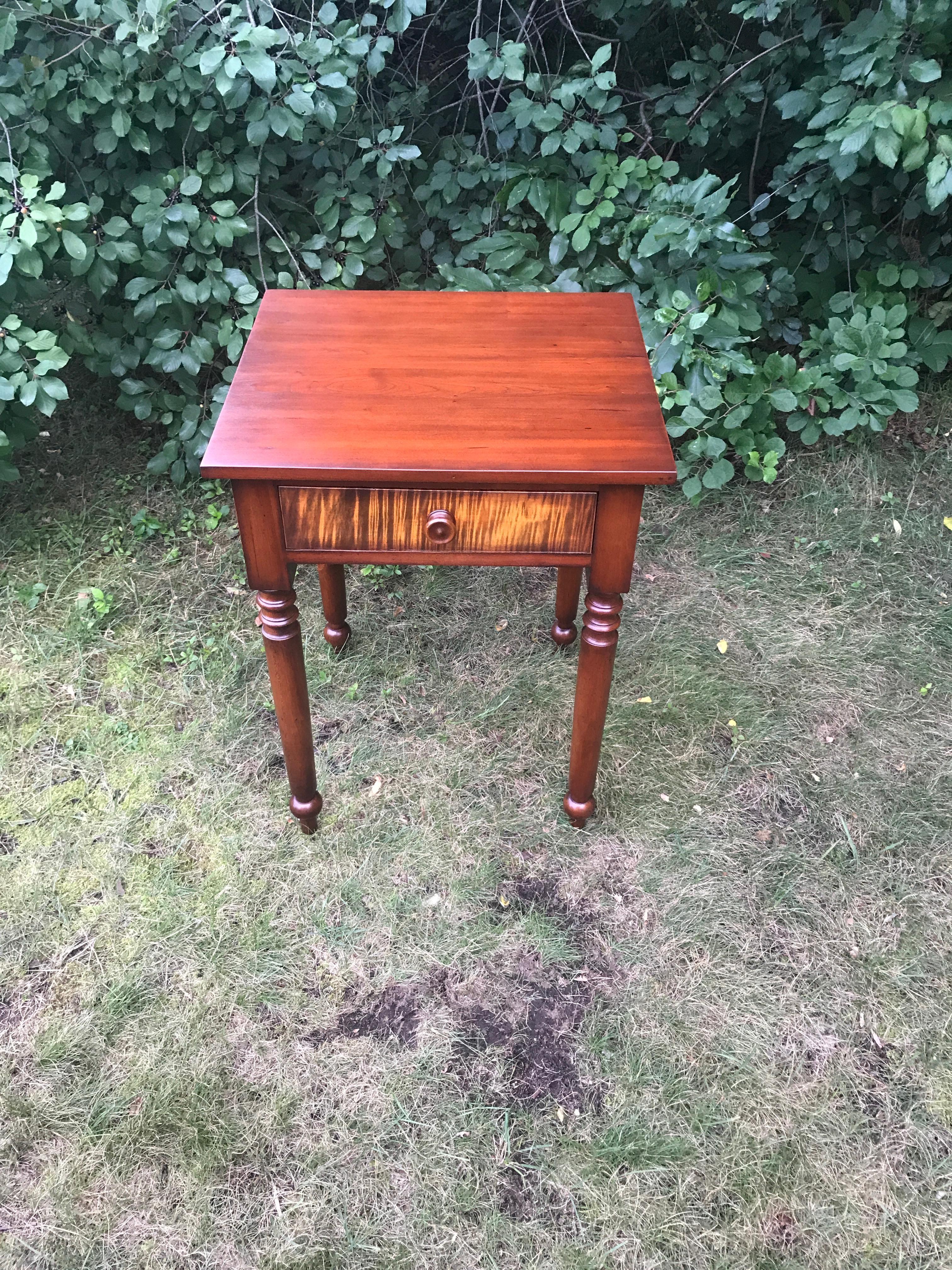 Sheraton nightstand in cherry with solid tiger maple drawer, circa 1820. Recently refinished. Measures: 28