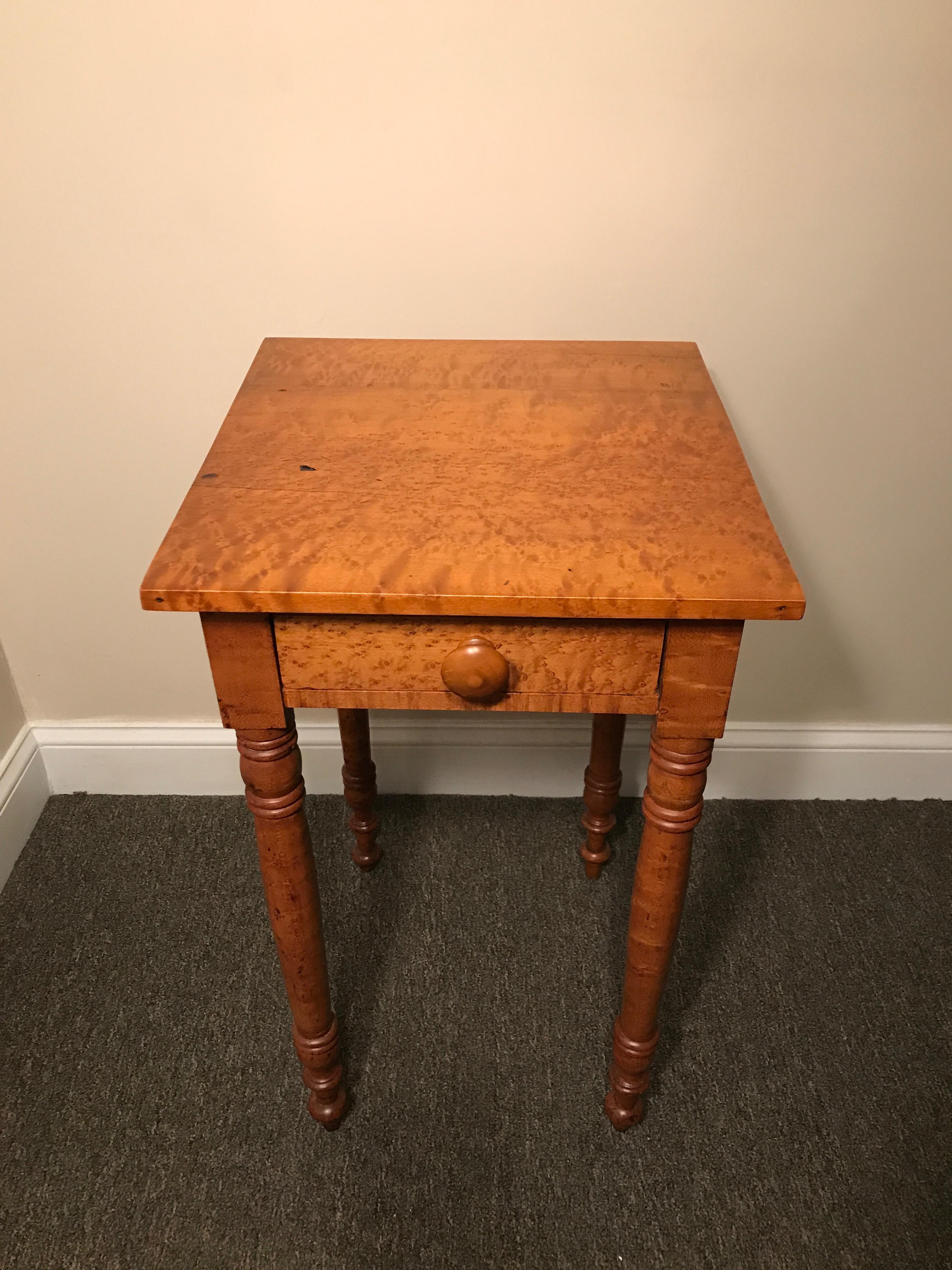 Sheraton one drawer stand in highly figured bird's-eye maple, circa 1810, Quincy, Ma. Turned legs, wooden knob, dovetailed drawers. Recent top repair and refinish in our shop. Base was cleaned and polished. A fine example of a Sheraton stand.