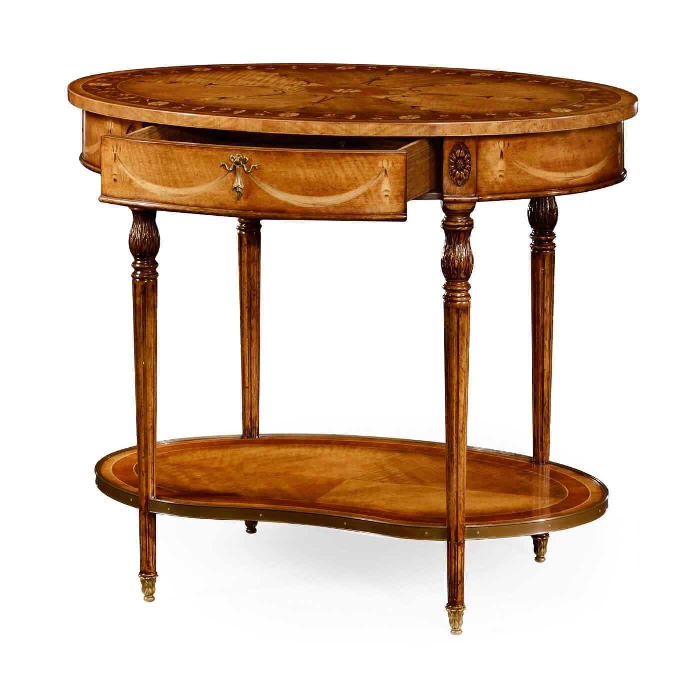 Sheraton inspired finely inlaid oval side table with swagged classical inlaid motifs, a perfectly matched bowknot and tassel drop handle, and a solid oak lined single drawer above a kidney-shaped under tier, with four acanthus carved capitals and