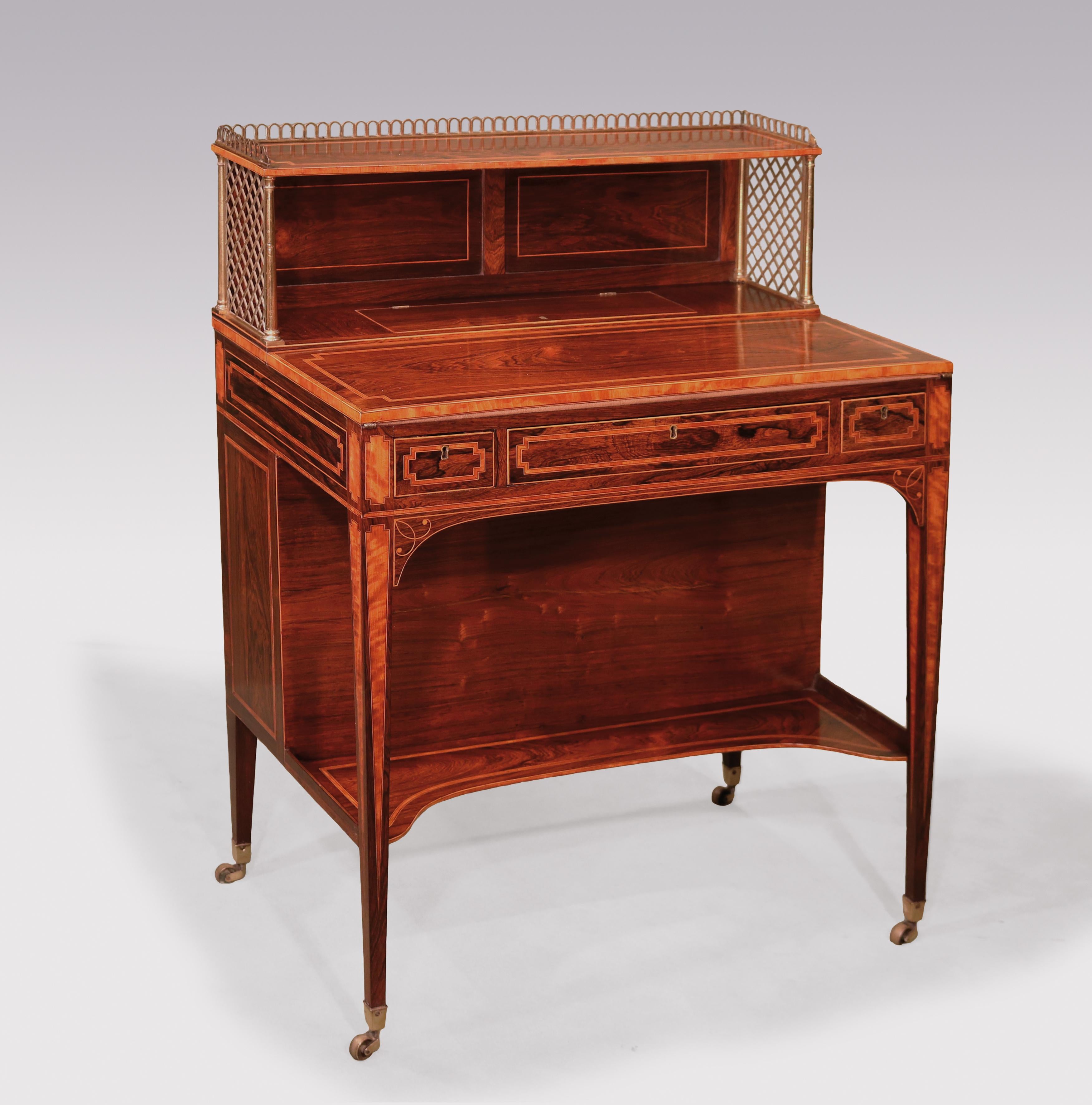 An unusual late 18th century Sheraton period rosewood artist's Bonheur du Jour boxwood and ebony strung and satinwood banded throughout, having brass galleried upper part above fold-over top revealing red leather writing surface and concealed