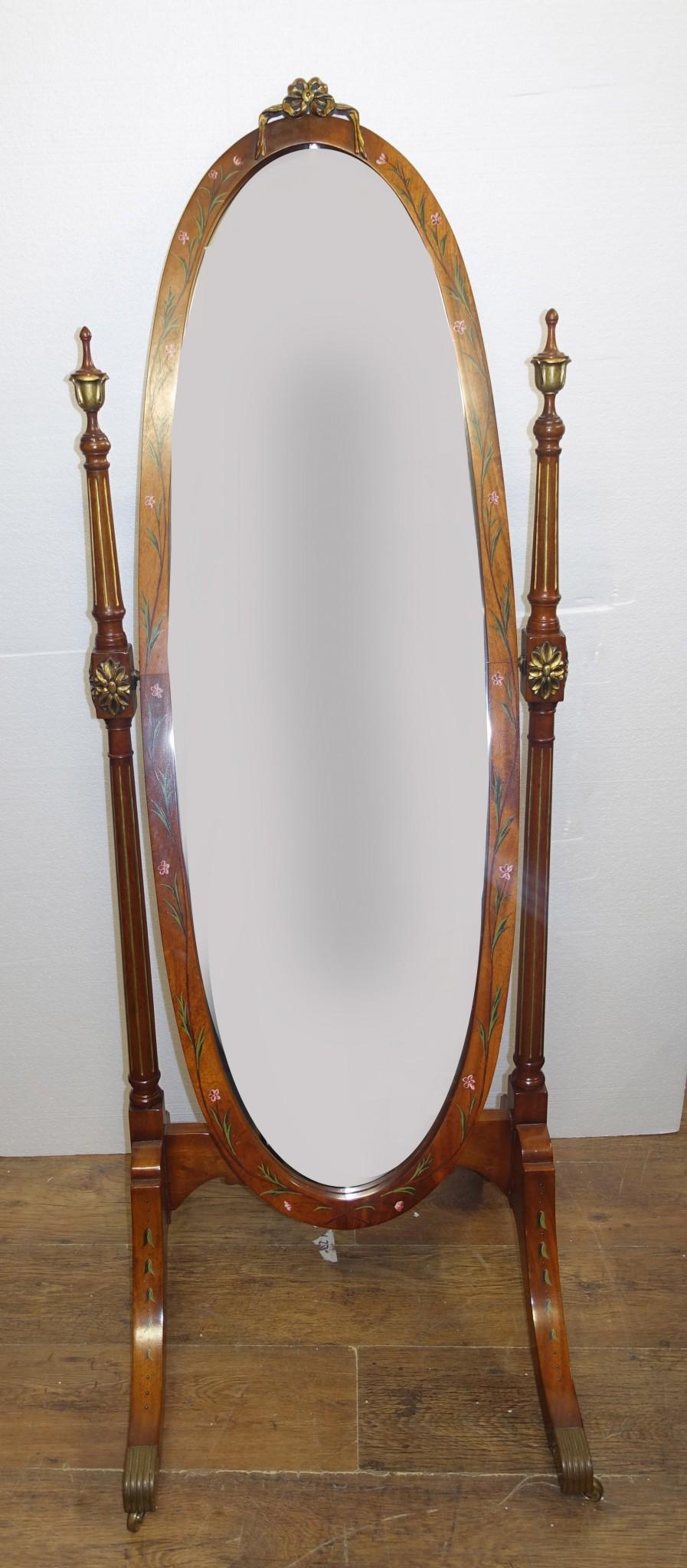 Elegant Sheraton revival satinwood cheval mirror
Great floor mirror, the oval frame swivels in the Frame Features original brass fixtures including the castors to the four feet
Wood has hand painted details showing floral motifs and leaves Circa