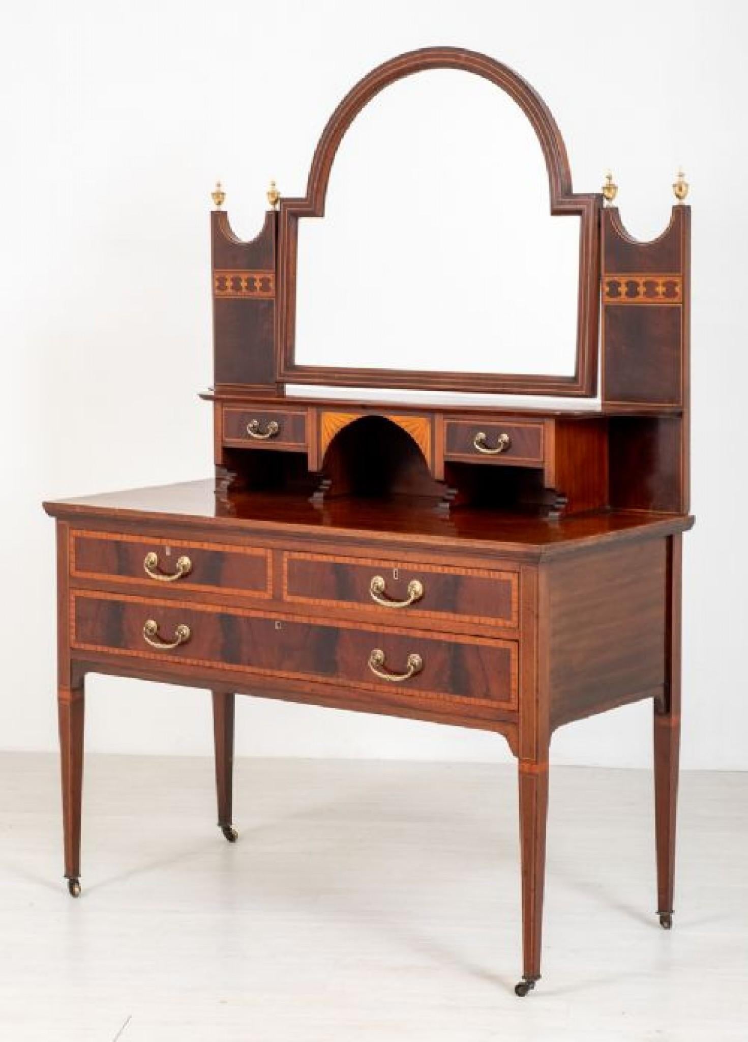 This excellent quality Sheraton Revival mahogany dressing table stands upon elegant tapered legs with original brass castors.
circa 1890
Having an arrangement of 2 over 1 mahogany lined drawers (note the fine dove tails)
The drawer fronts having