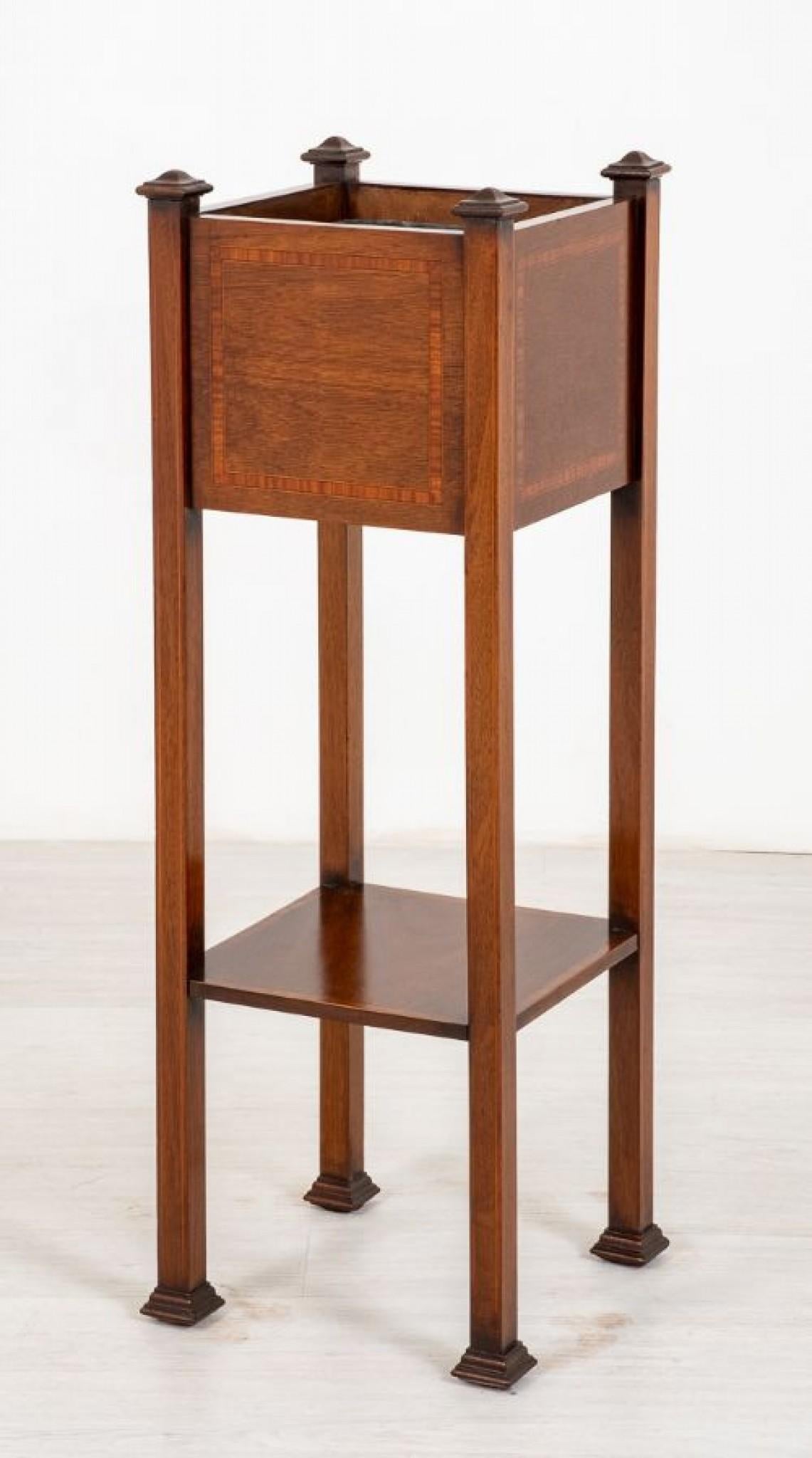 Sheraton revival mahogany plant stand.
Standing upon square legs with block feet.
Having an inlaid under tray.
circa 1900
The plant holder also featuring satinwood inlays and a metal liner.