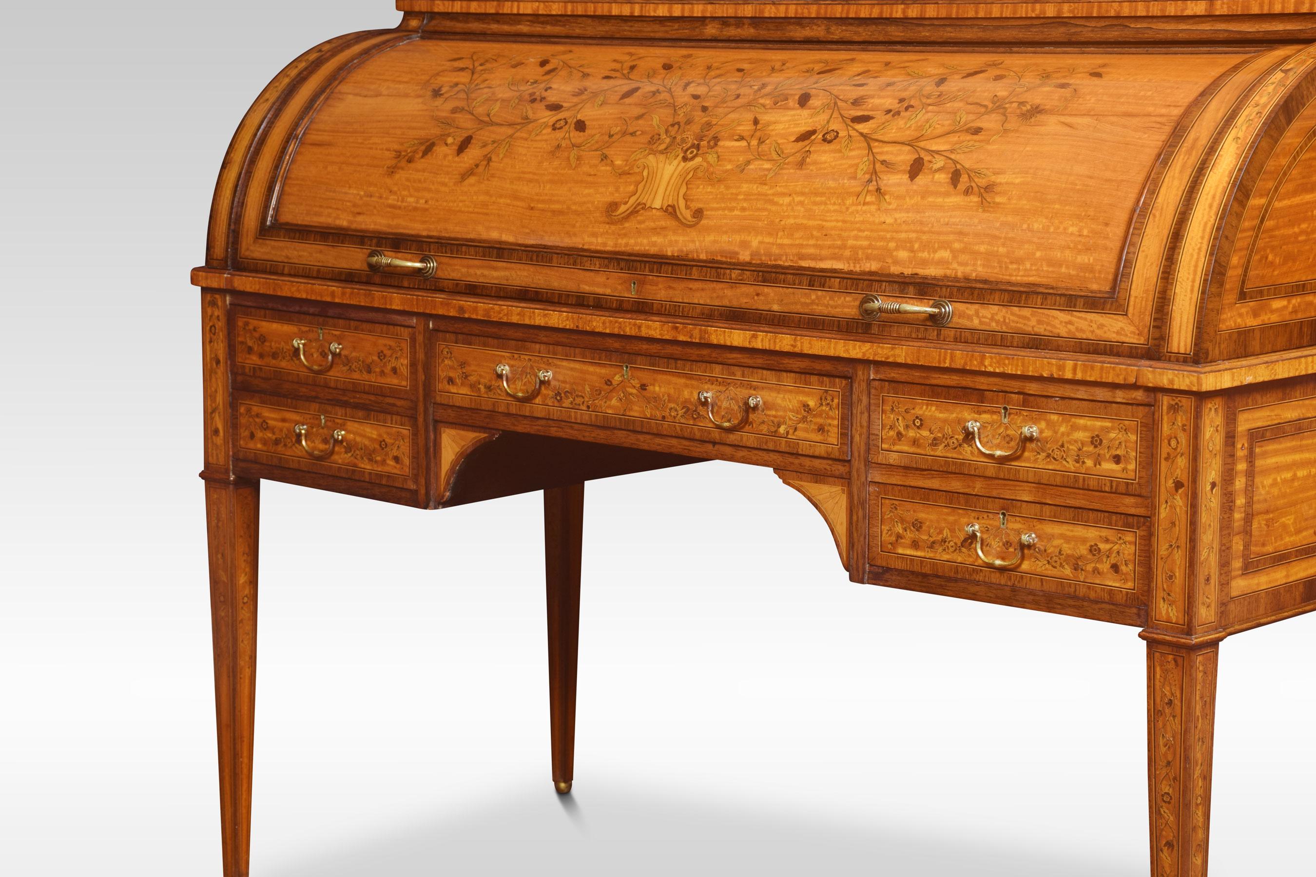 Sheraton revival satinwood and rosewood crossbanded cylinder bureau, the raised three-quarter galleried superstructure above a roll top with marquetry inlaid floral decoration, enclosing a fitted interior. Having an arrangement of five further