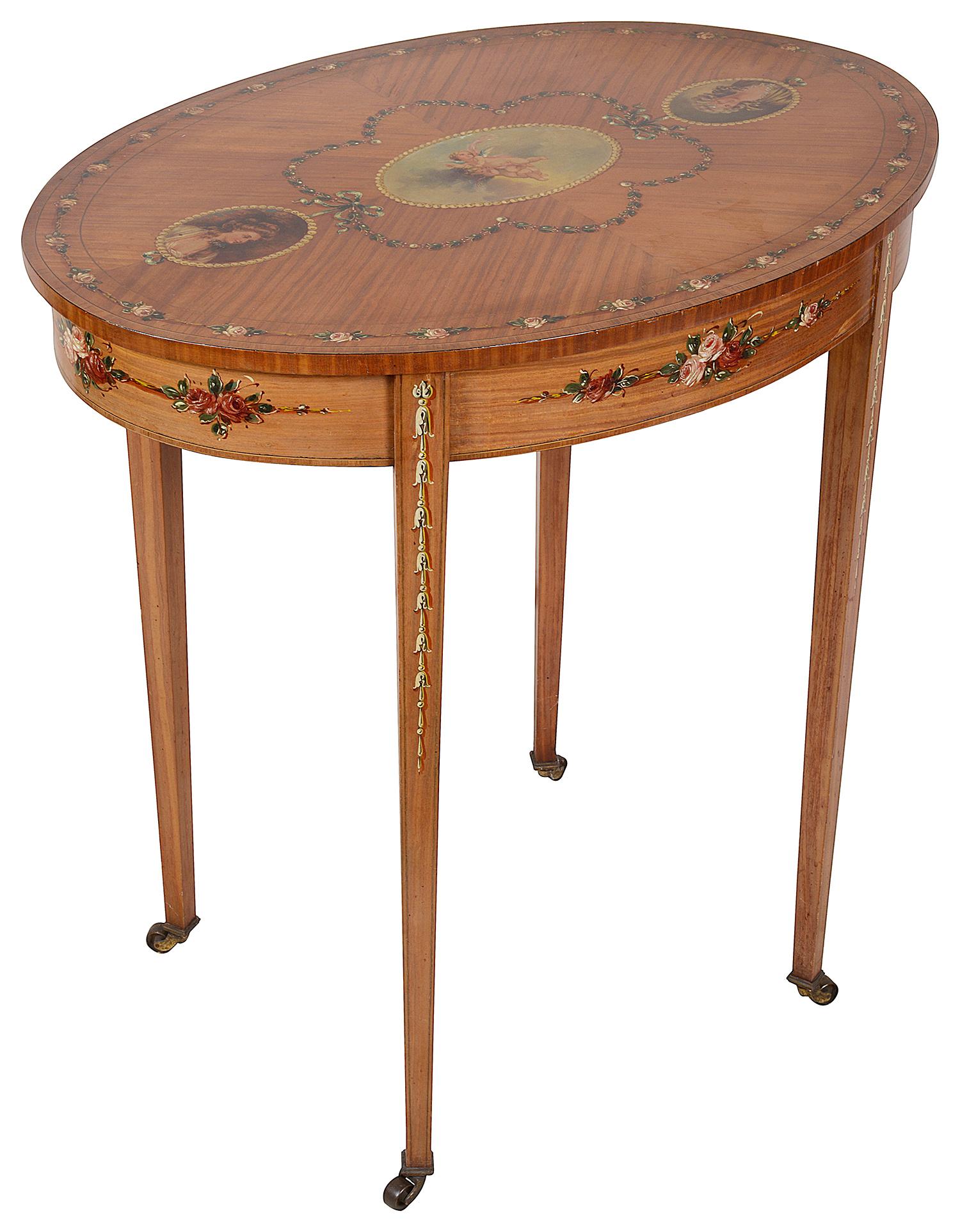A good quality late 19th century satinwood, Sheraton Revival side table, having hand painted floral swag decoration to the top and frieze, oval panels depicting cherubs and classical ladies. Raised on square tapering legs, terminating in brass