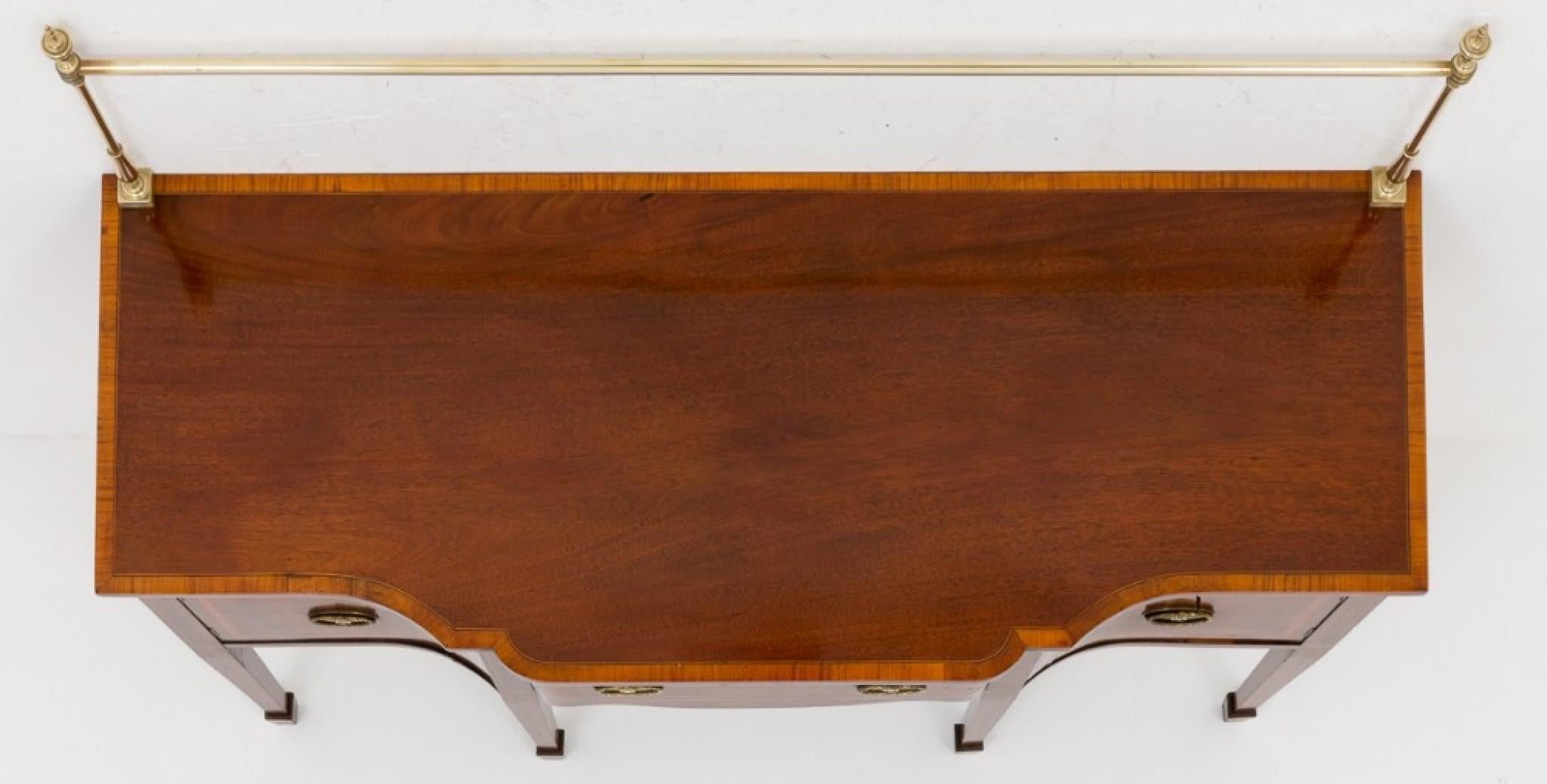 Very Pretty Mahogany Sheraton Revival Sideboard, standing on square tapered legs with spade toes and boxwood inlays.
circa 1880
This piece is of serpentine form.
The central drawer flanked by working cupboards.
The sideboard has satinwood