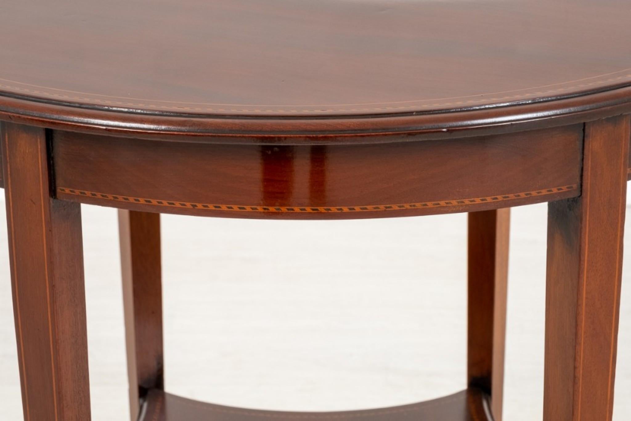 Sheraton Revival mahogany centre table.
Standing upon 6 tapered legs with a shaped undertray.
circa 1890
The circular top having chequered inlays and boxwood line inlay.
This elegant table is presented in good condition.