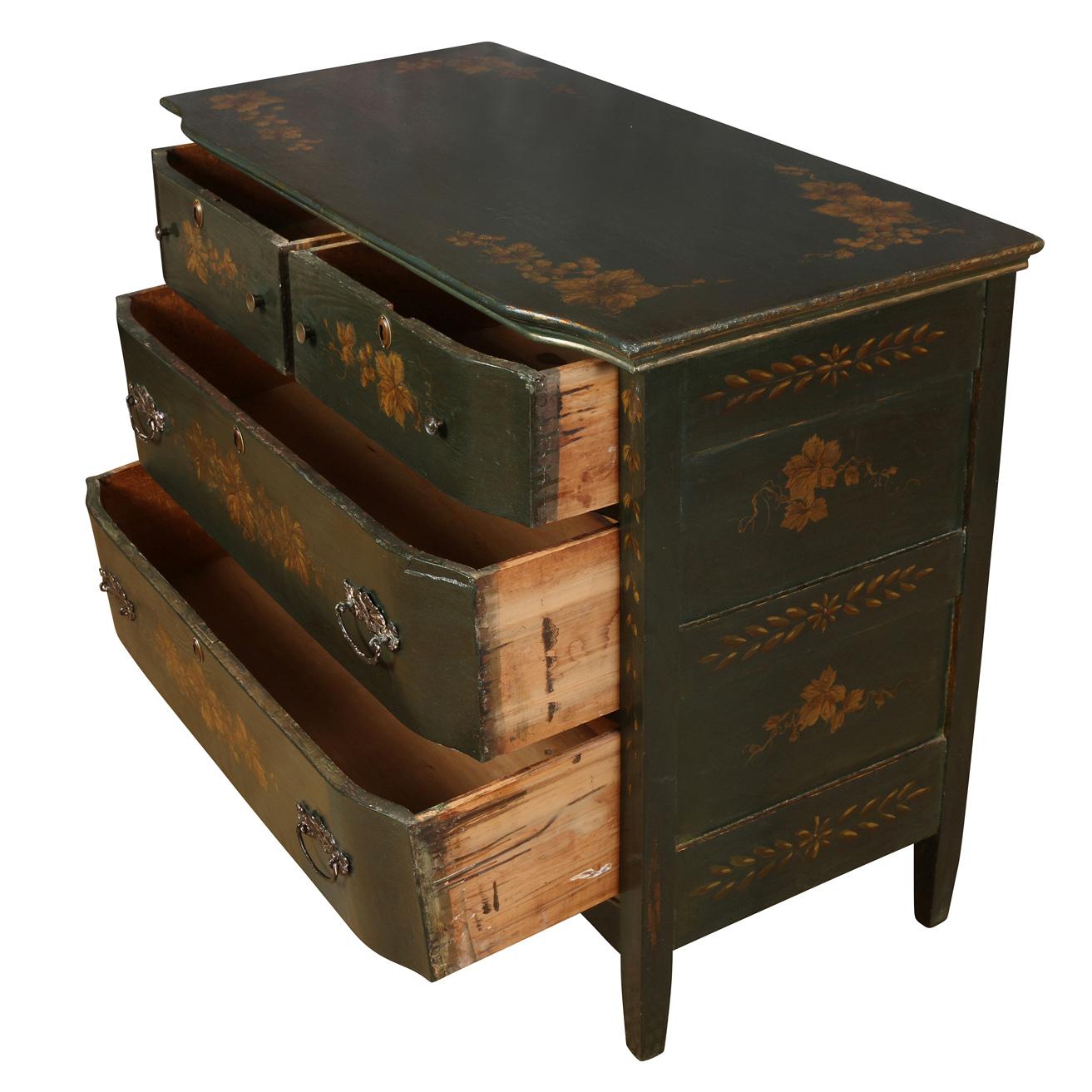 A charming dresser with two small drawers and two large drawers, raised on tapered legs.  The dresser is painted in a dark green lacquer and decorated with a lovely floral motif on top, front and sides.  The angled top and drawers and the scalloped