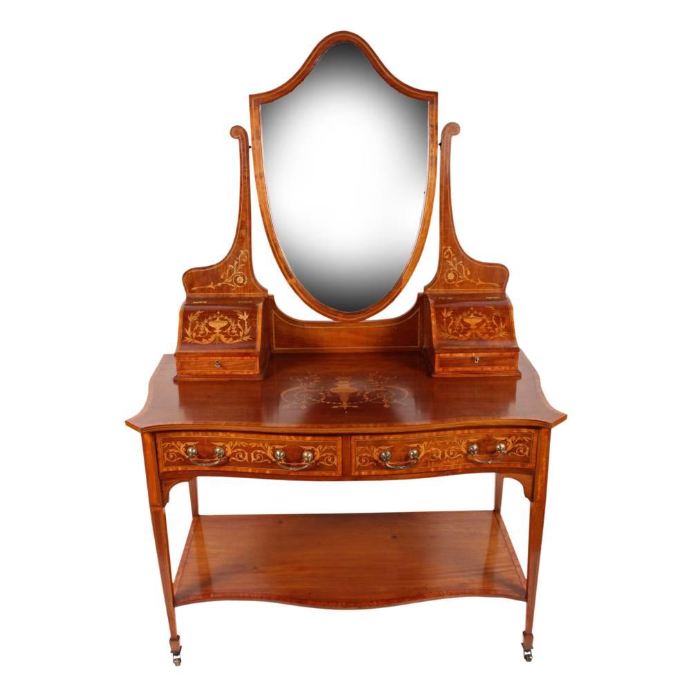 Sheraton style mahogany and inlaid dressing table, circa 1900. Exhibition quality, with a bevelled edge mirror in a mahogany frame with ebony and boxwood inlay, held in place by shaped uprights. There is floral marquetry to the base, with small