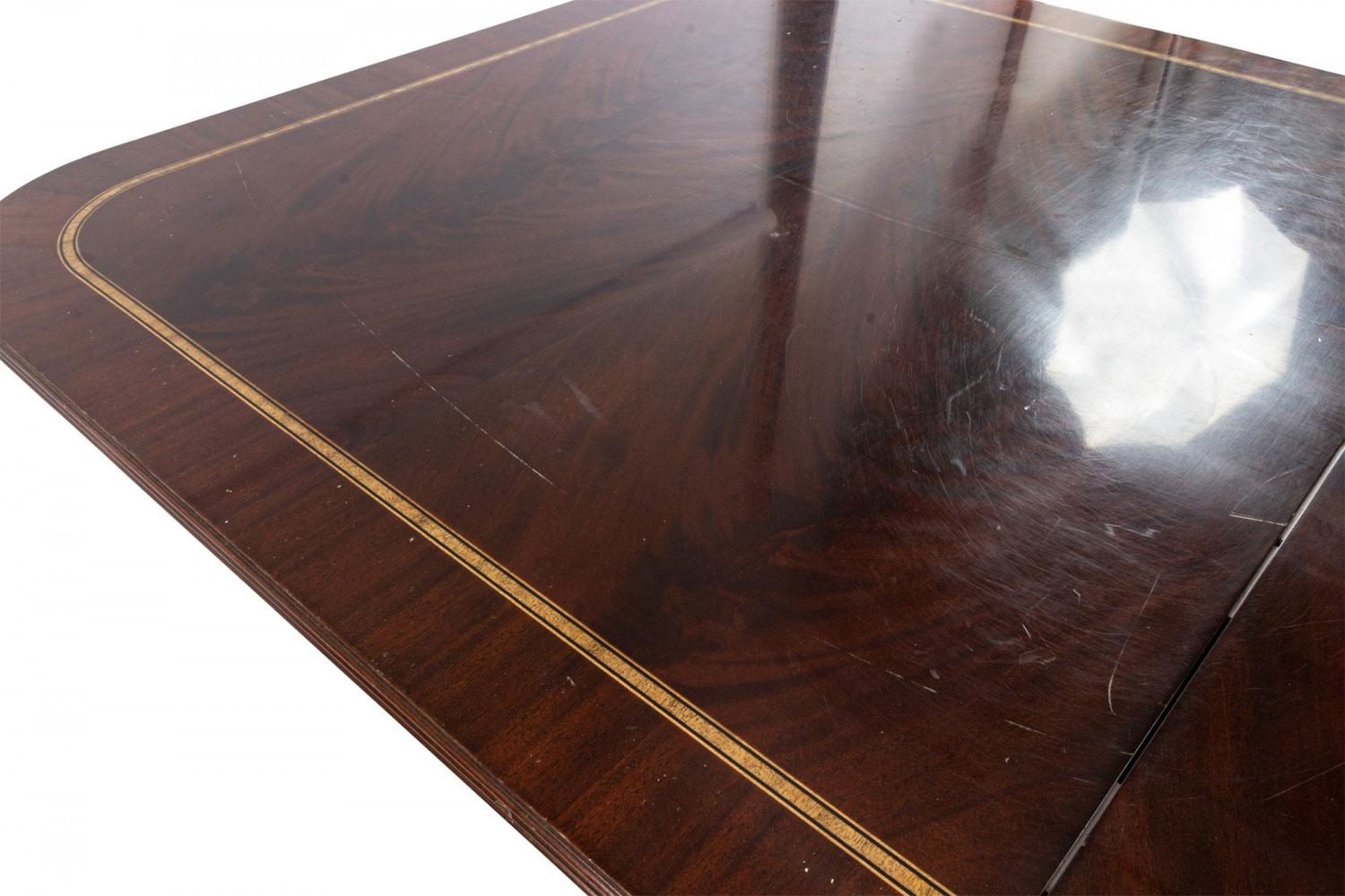 20th Century Sheraton Style Mahogany Dining Table with Inlay and Paw Feet For Sale