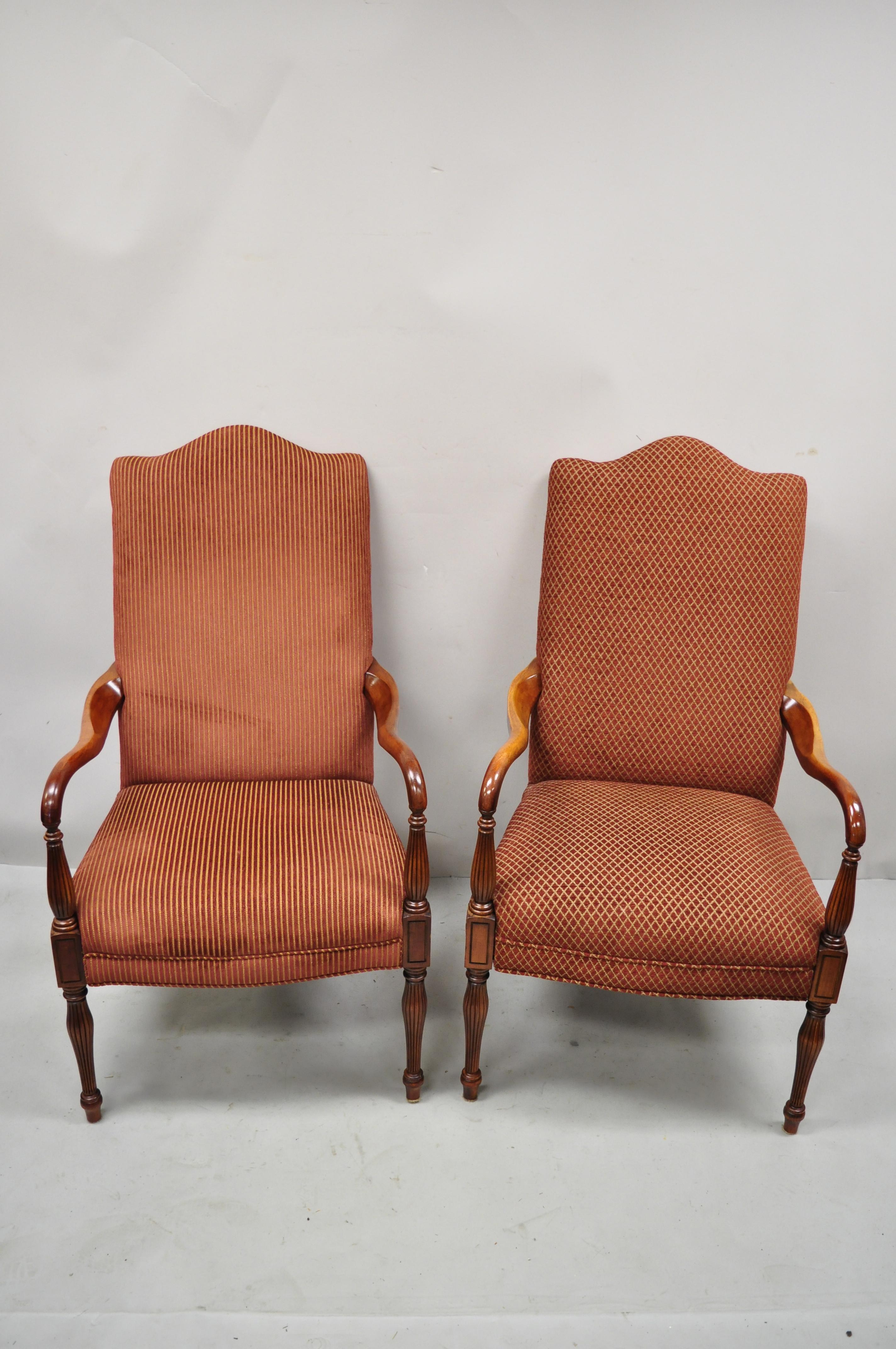 Vintage Sheraton style red upholstered high back fireside lounge arm chairs - a Pair. Item features solid wood frames, nicely carved details, tapered legs, great style and form. Age: Late 20th century. Measurements: 44