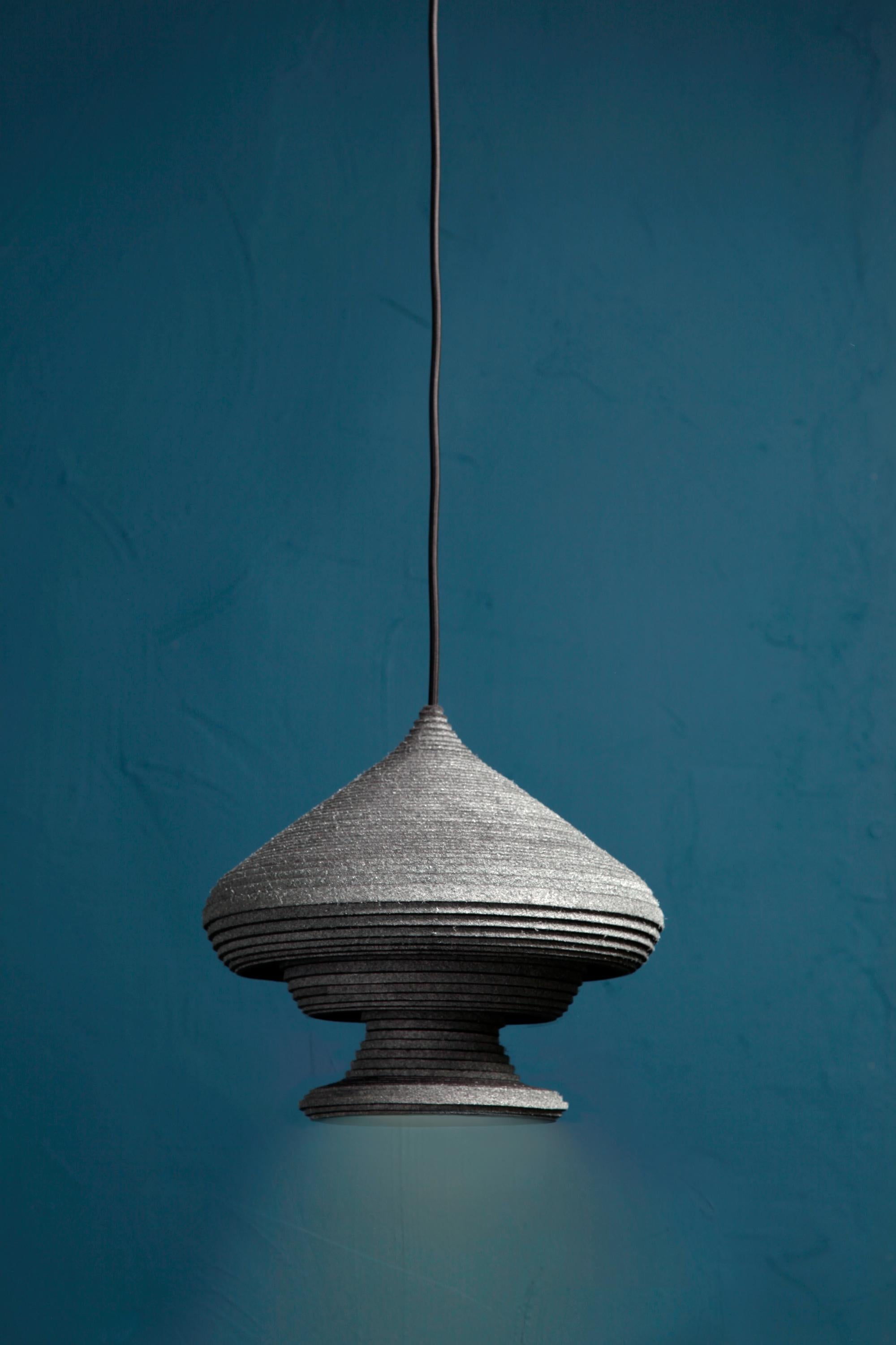 Sherazade pendant lamp by Siba Sahabi
Limited edition of: Limited edition of: 12 of each design + 2 AP + 1 P
Vase N.I: 26 x 31 x 31 cm
Signed and numbered


Inspired by nighttime silhouettes of Middle Eastern rooftops, this collection is