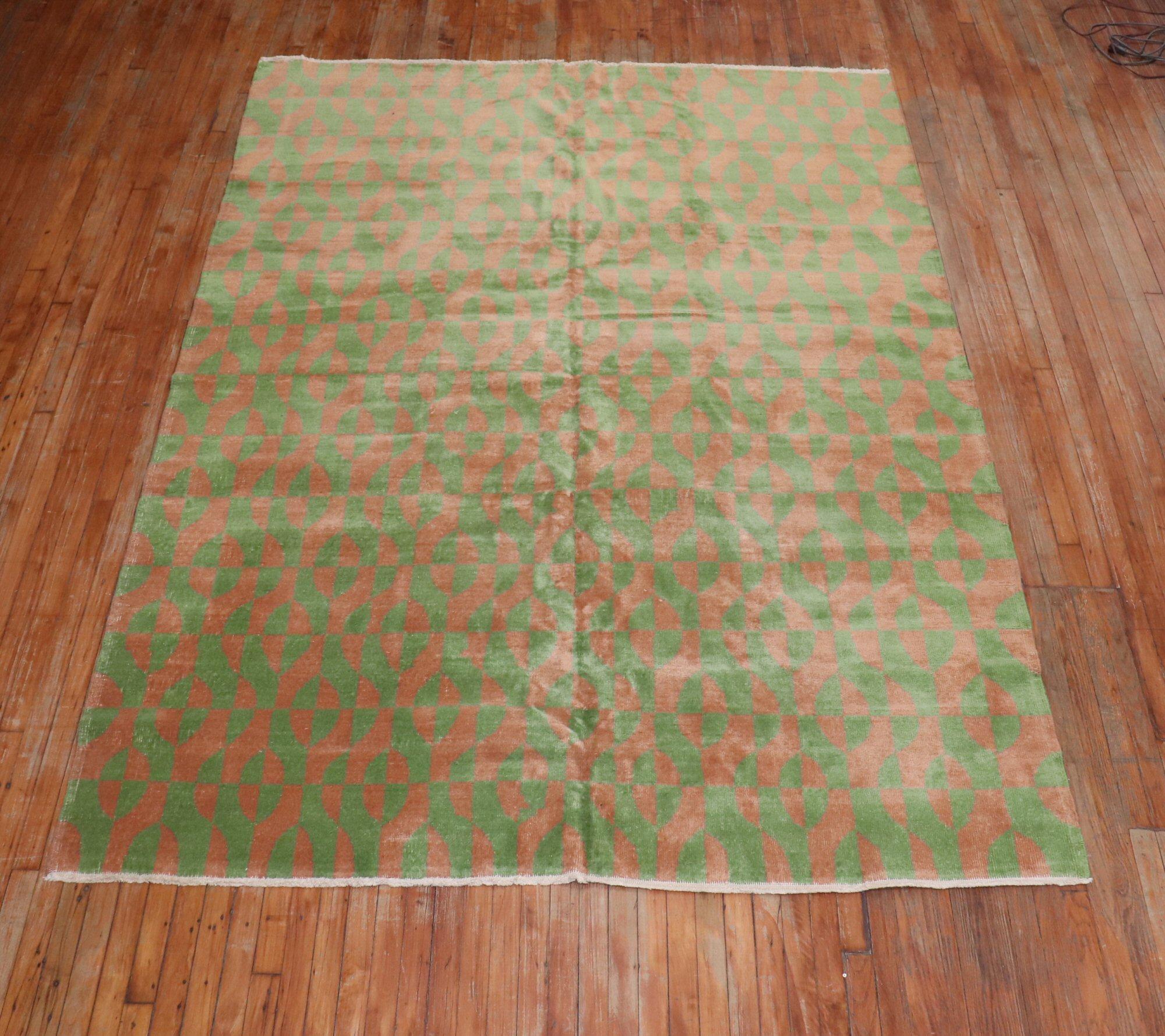 Midcentury Turkish deco rug in greens and cantaloupe. The rug was probably custom made in the middle of the 20th century inspired by the art deco movement.

Measures: 7' x 9'10