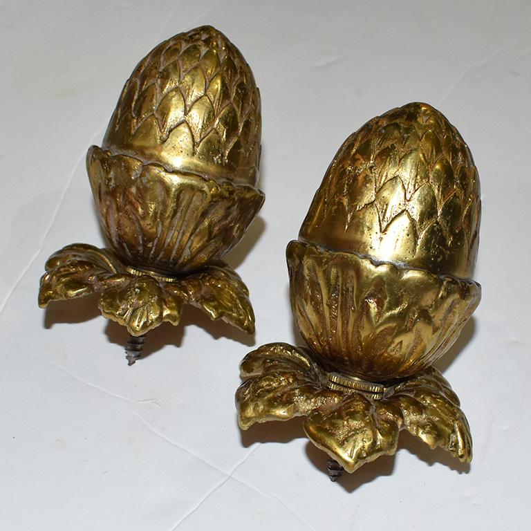 Beautiful gold brass acorn finial or bathroom decor accessory by Sherle Wagner. This piece is shaped in the form of an acorn, with leaves that curl downward. The leaves are detachable from the acorn with a screw. This could be used as a finial
