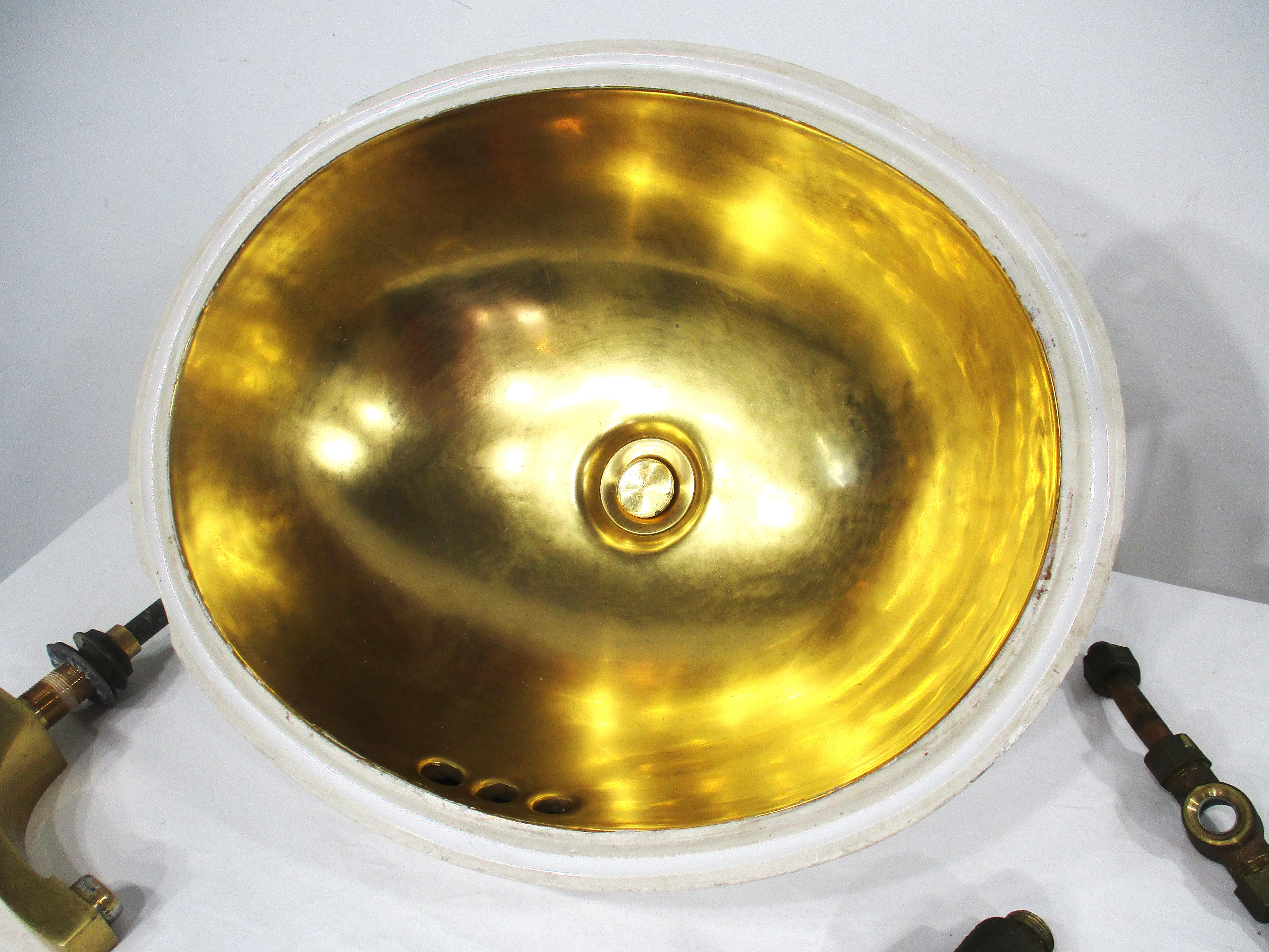 A well crafted set of fixtures having cut glass styled crystal lower handle bases with decorative 24K gold plated laurel mounting plates  . The sink , faucet , porcelain bowl and bottom drain cover also have a 24K plating . Manufactured to a very
