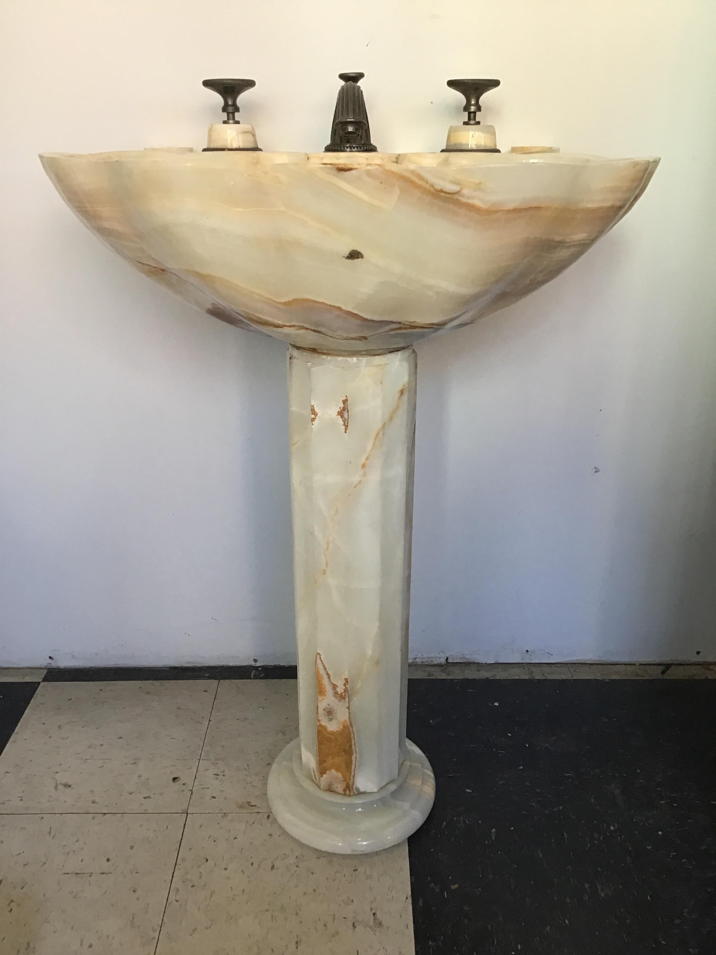 Sherle Wagner onyx pedestal sink and faucet. Quite for a new sink is 27,000.00.