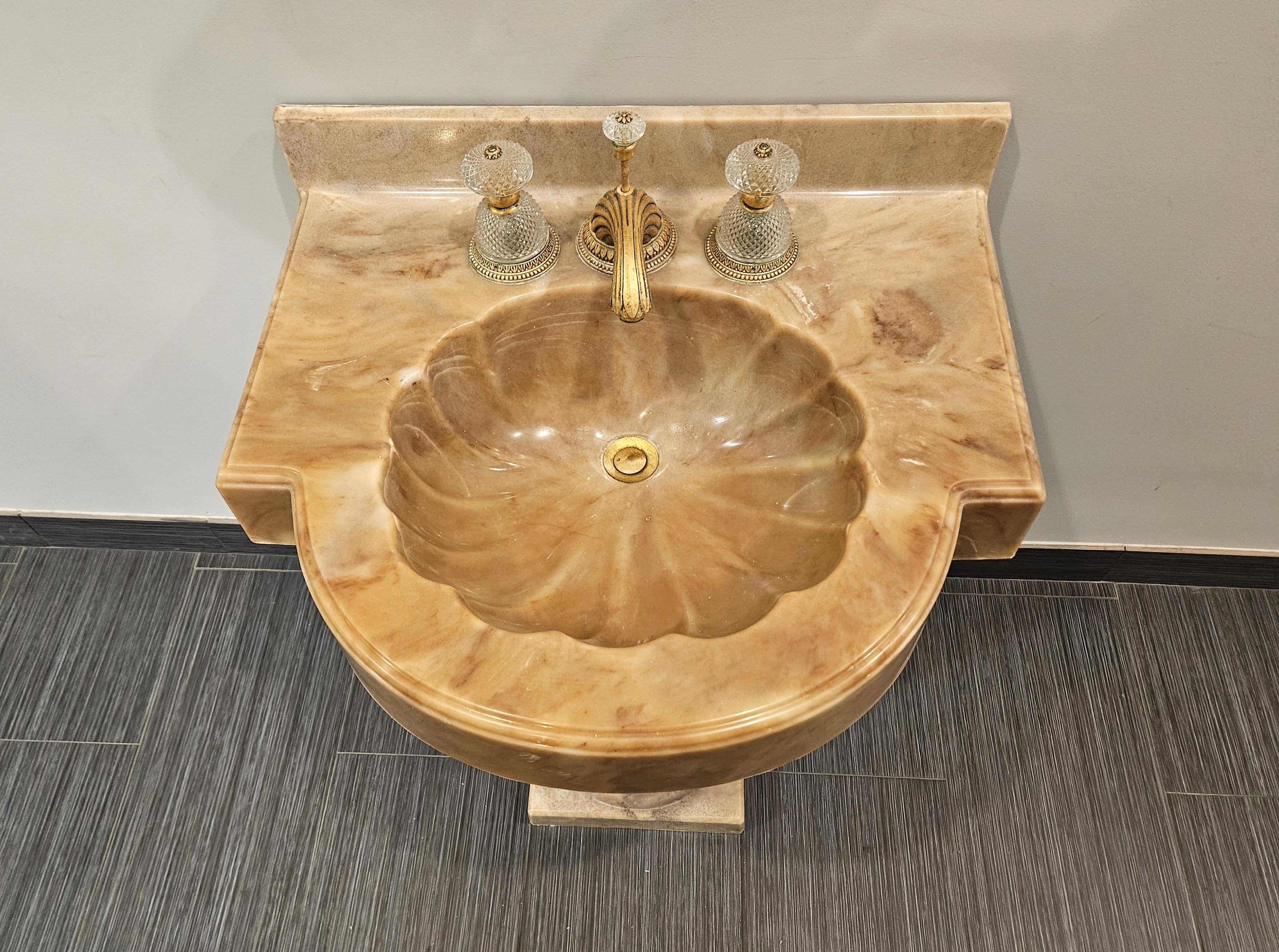 Sherle Wagner Onyx Pedestal Sink.  Sherle Wagner International has been the premier world-wide source for luxury hardware and bath accessories since its founding in 1945.  Currently operated by the family's third generation!  Mr Wagner elevated