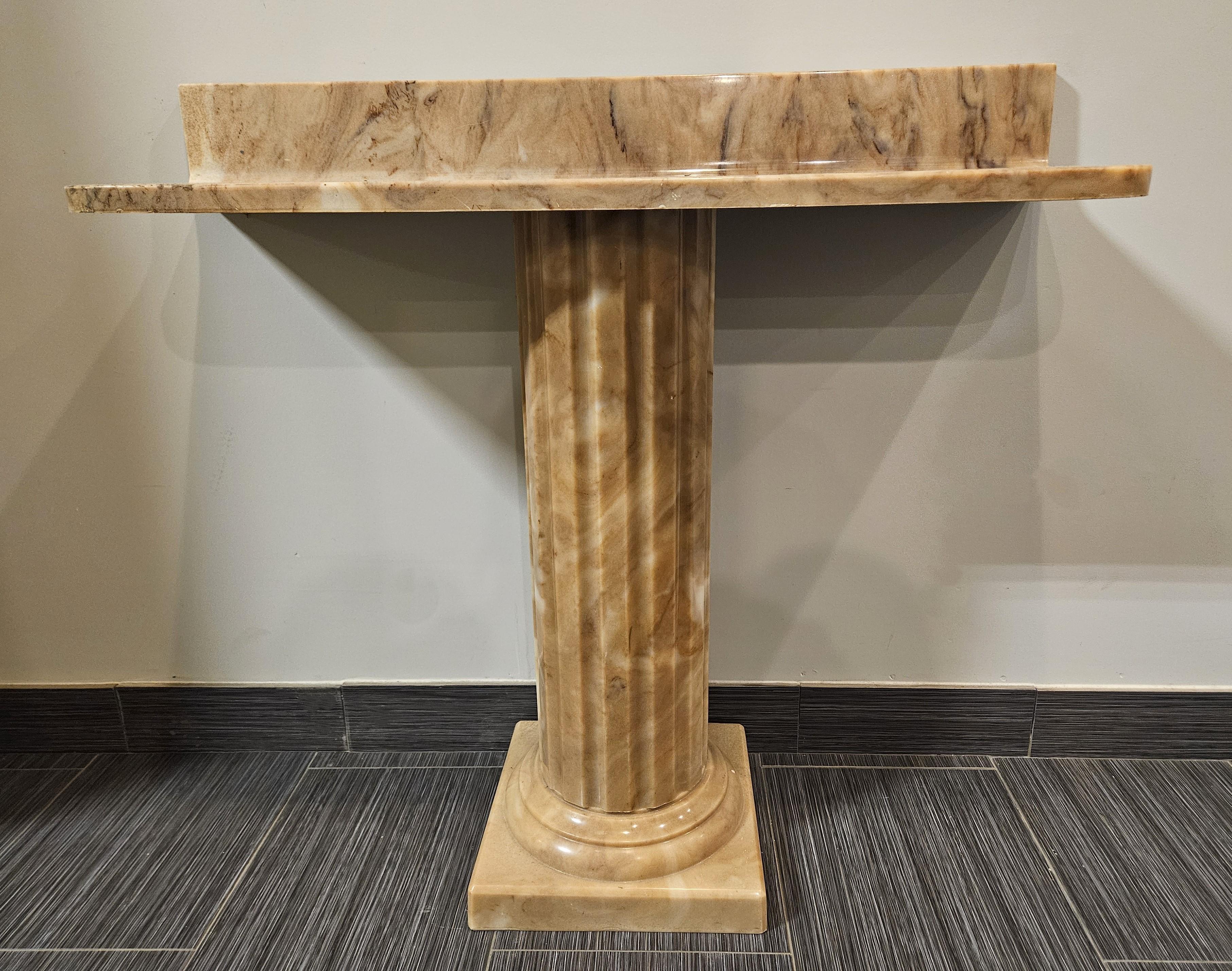 This Sherle Wagner console would be a stunning addition to a foyer, dining room, bedroom or bathroom. The top has a lovely grain pattern that sits on a separate fluted column base.  Top and base are separate for easy transporting!  Sink and pedestal