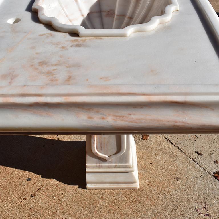 Sherle Wagner Pink Marble Pedestal Sink in Rose Aurora Marble