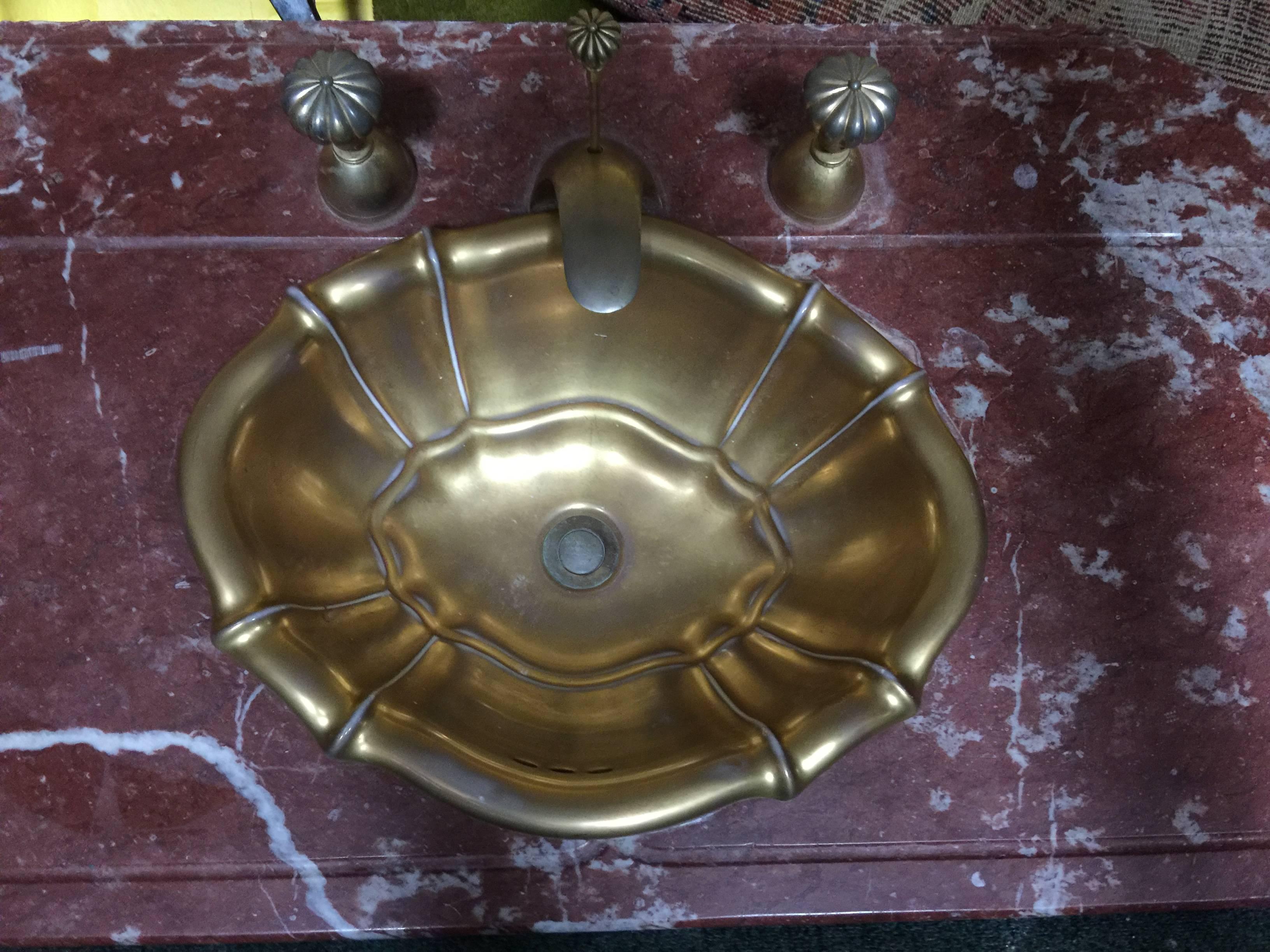 Beautiful deep rouge marble sink top with antique gold plated solid brass bowl, faucet, stopper and handles. Designed in Italy in The 1970s.This a quality highly decorative sink top.
