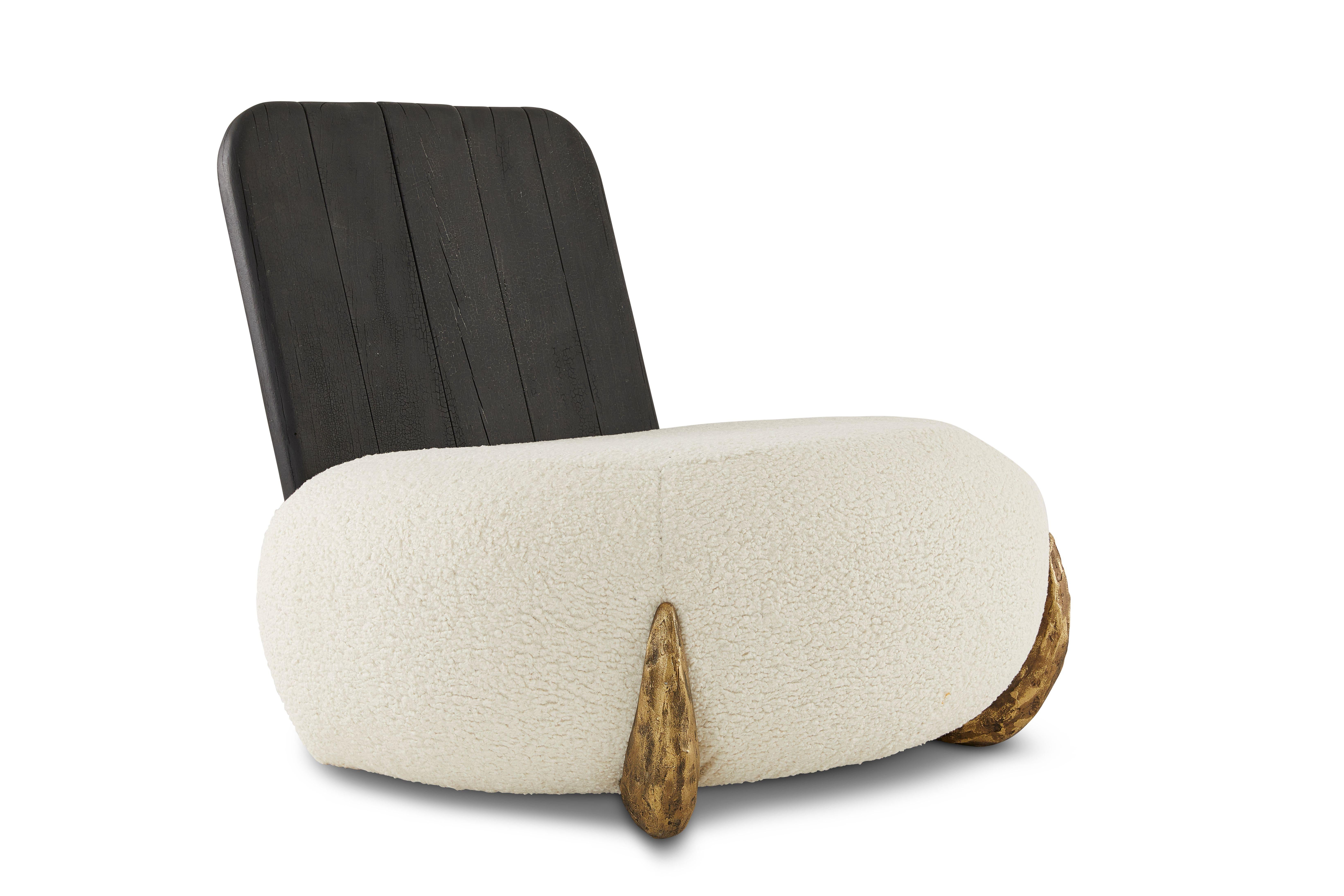 Sherpa lounge chair by Egg Designs
Dimensions: 95 L X 90 D X 77 H cm
Materials: Solidcast brass, Boucle upholstry, Shou Sugi ban hard wood

Founded by South Africans and life partners, Greg and Roche Dry - Egg is a unique perspective in