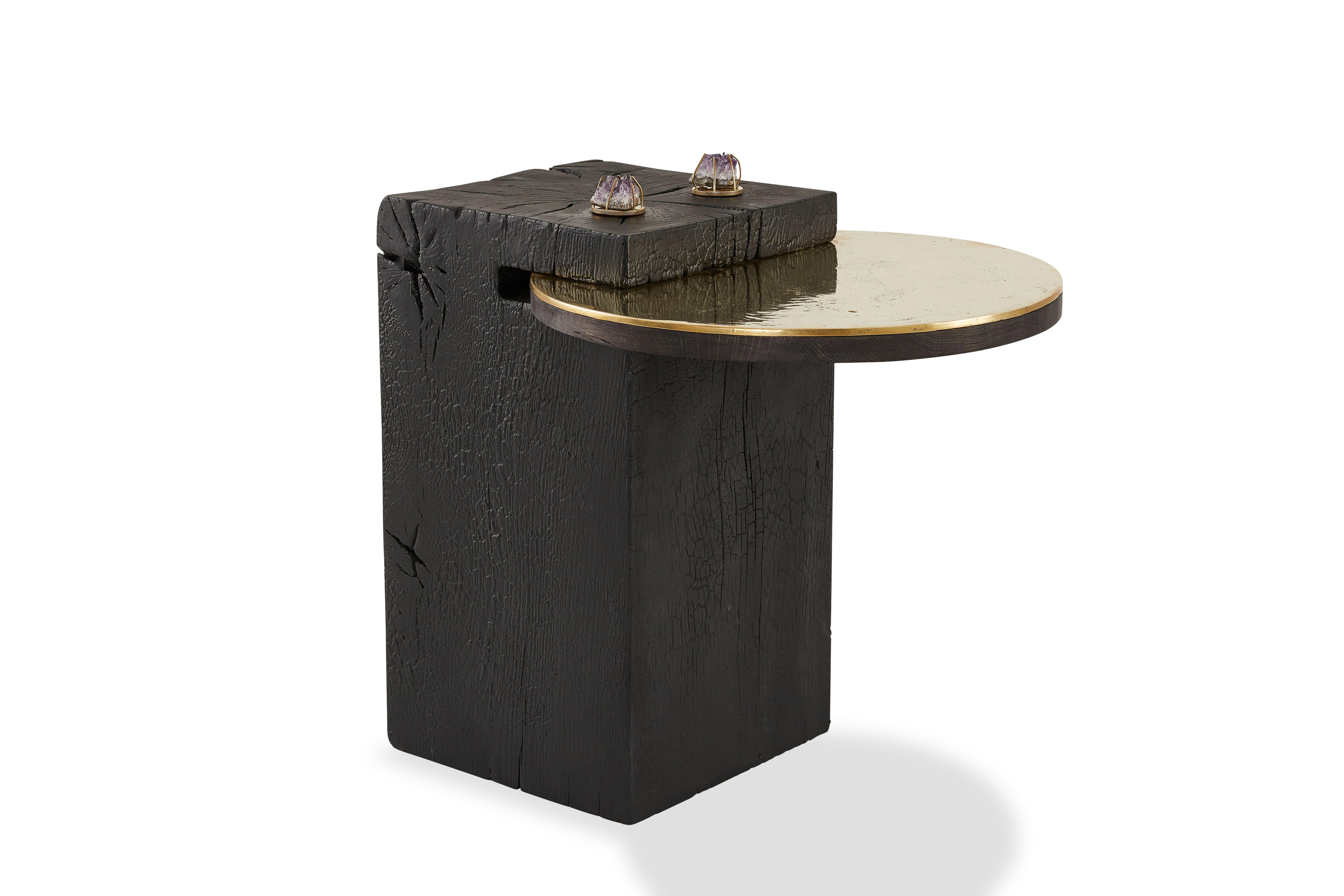 Sherpa side table by Egg Designs
Dimensions: 49 L x 64 D x 63 H cm 
Materials: Shou Sugi Ban hardwood timber, solid cast polished brass, brass, amethyst crystal

Founded by South Africans and life partners, Greg and Roche Dry - Egg is a unique