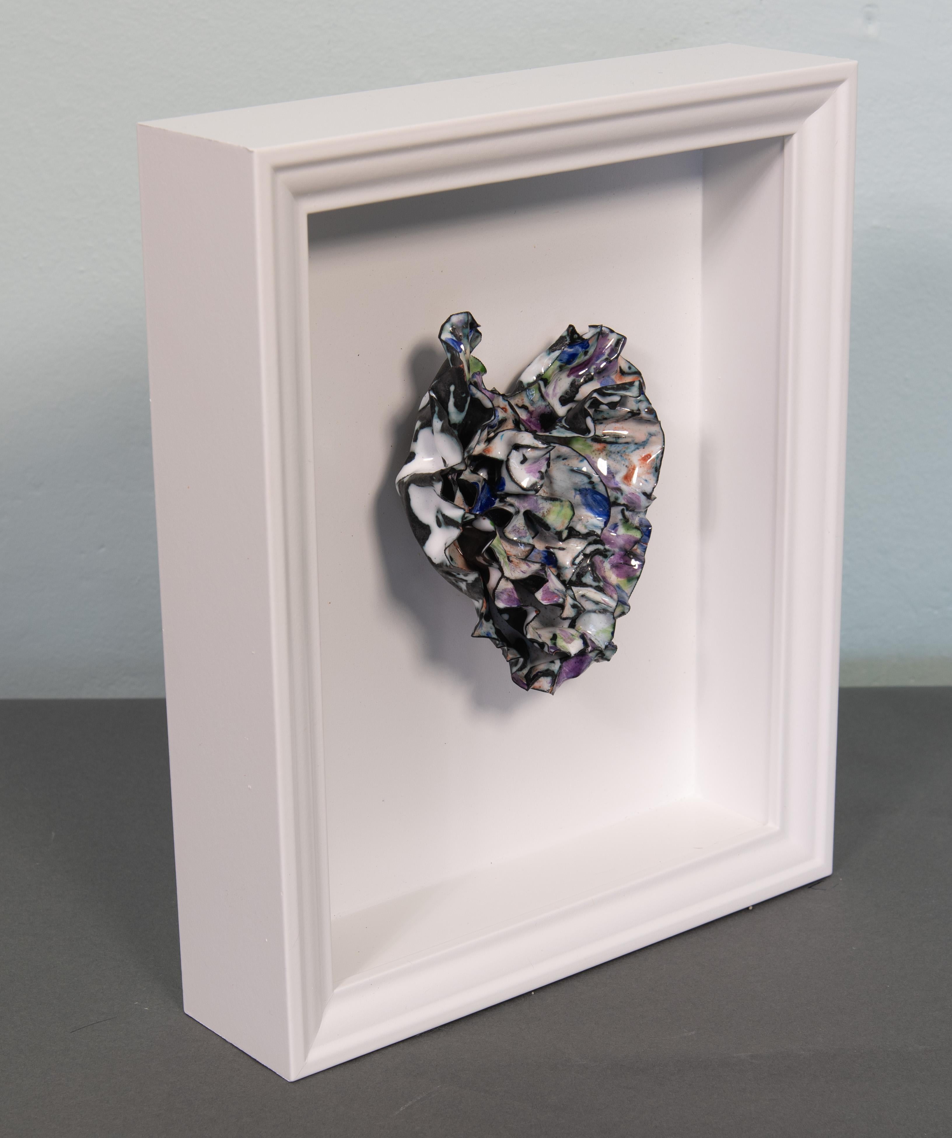
Prismatic Heart, a captivating abstract enameled sculpture that embodies the vibrant colors of the rainbow in a dance of light and color. Sculpted by Sherry Been.
The 