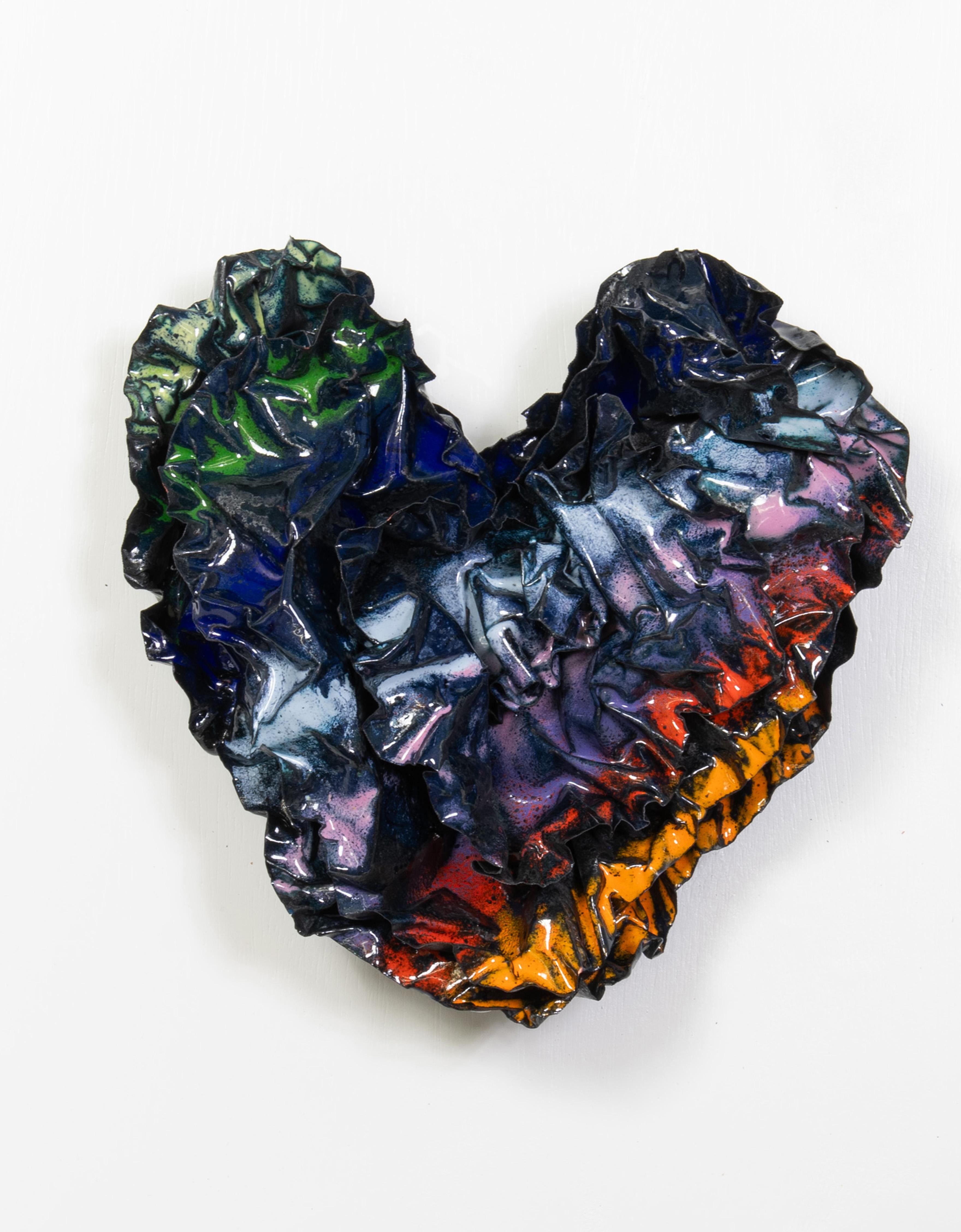 This heart was created with a rainbow of colors on a black background and with many layers of  copper to give the sculpture depth and intrigue.  This sculpture honors our LGBTQIA2S Community by representing the rainbow of colors.  This Heart was