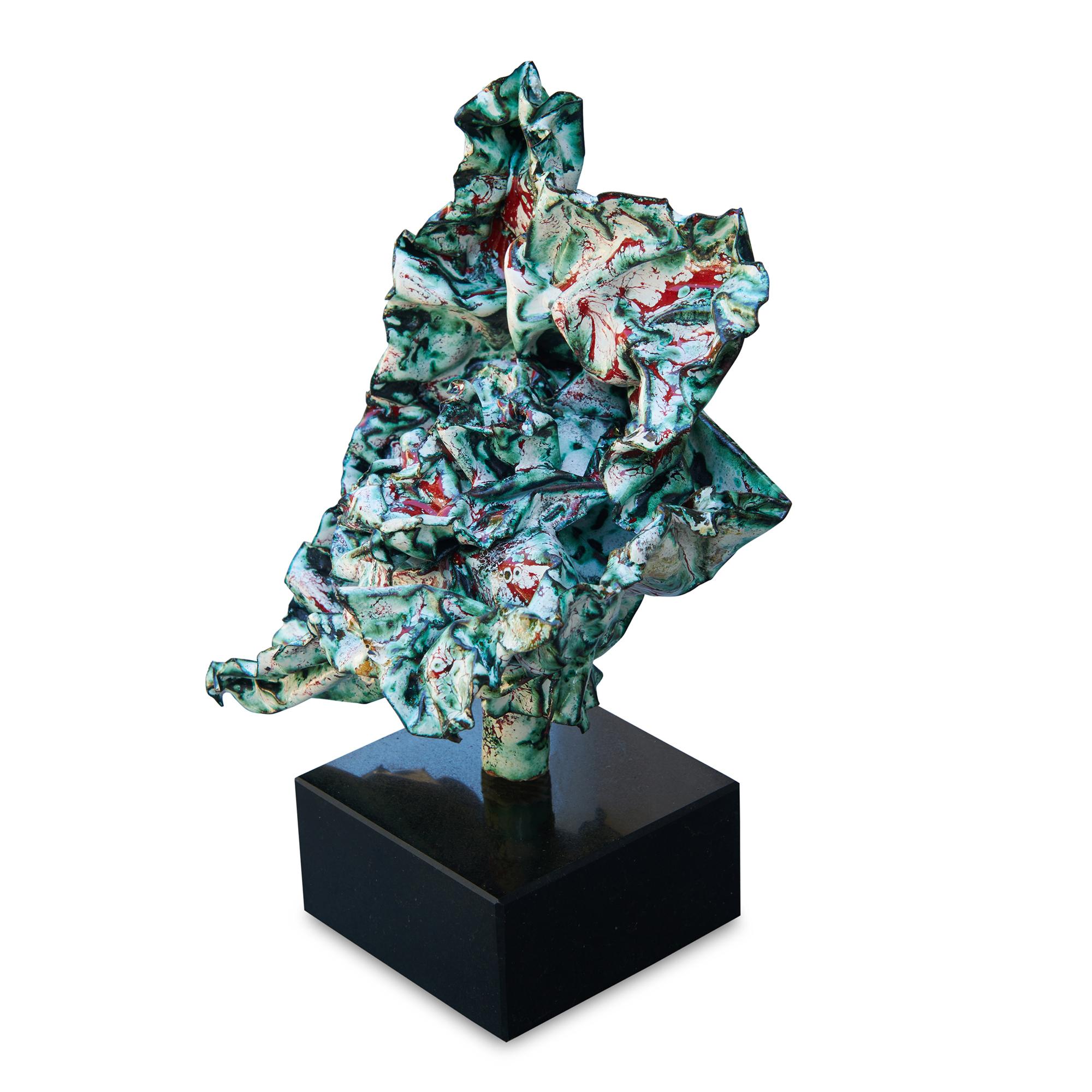 This visceral sculpture undulates with movement and colors of bright red on white.  Blacks and greens that emerged during the heating process appears throughout the sculpture, highlighting the intrigue of this fascinating and complex work of art.  
