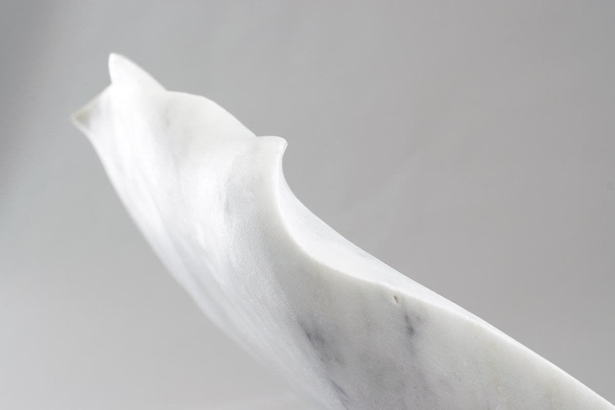 Presented is a one-of-a-kind single edition sculpture by female sculptor artist Sherry Rossini. Hand carved by the artist while studying in Pietrastanta, Italy. Carved from marble that was mined from Monte Altissimo Mountains in Carrara, Italy. The