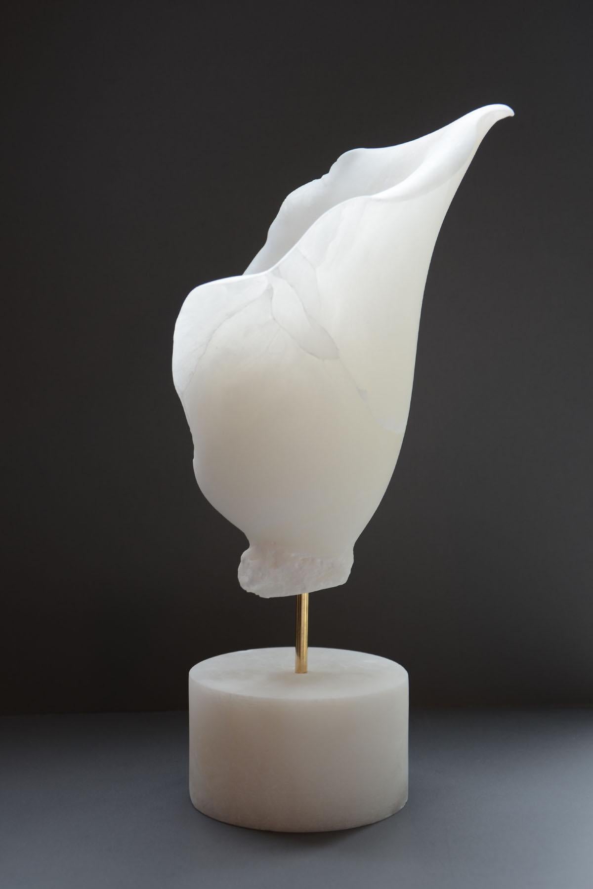 Presented is a one-of-a-kind single edition sculpture by female sculptor artist Sherry Rossini. Hand carved by the artist from alabaster stone that was imported from Italy. The base also is carved from the same imported alabaster stone. The