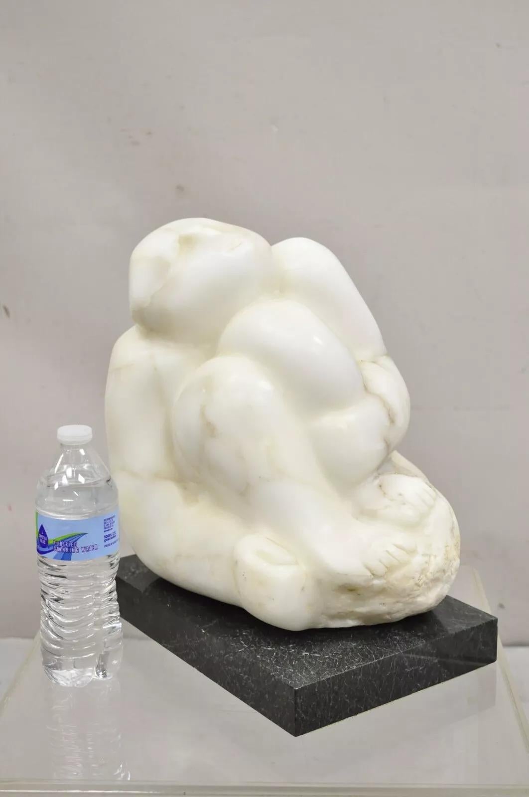 Sheryl Cannold Benjamin (American, 1924 - 2023) Marble Nude Figure Abstract Sculpture On Marble Base. Circa Late 20th Century. Weighs approximately 60 pounds. Measurements: 13.5