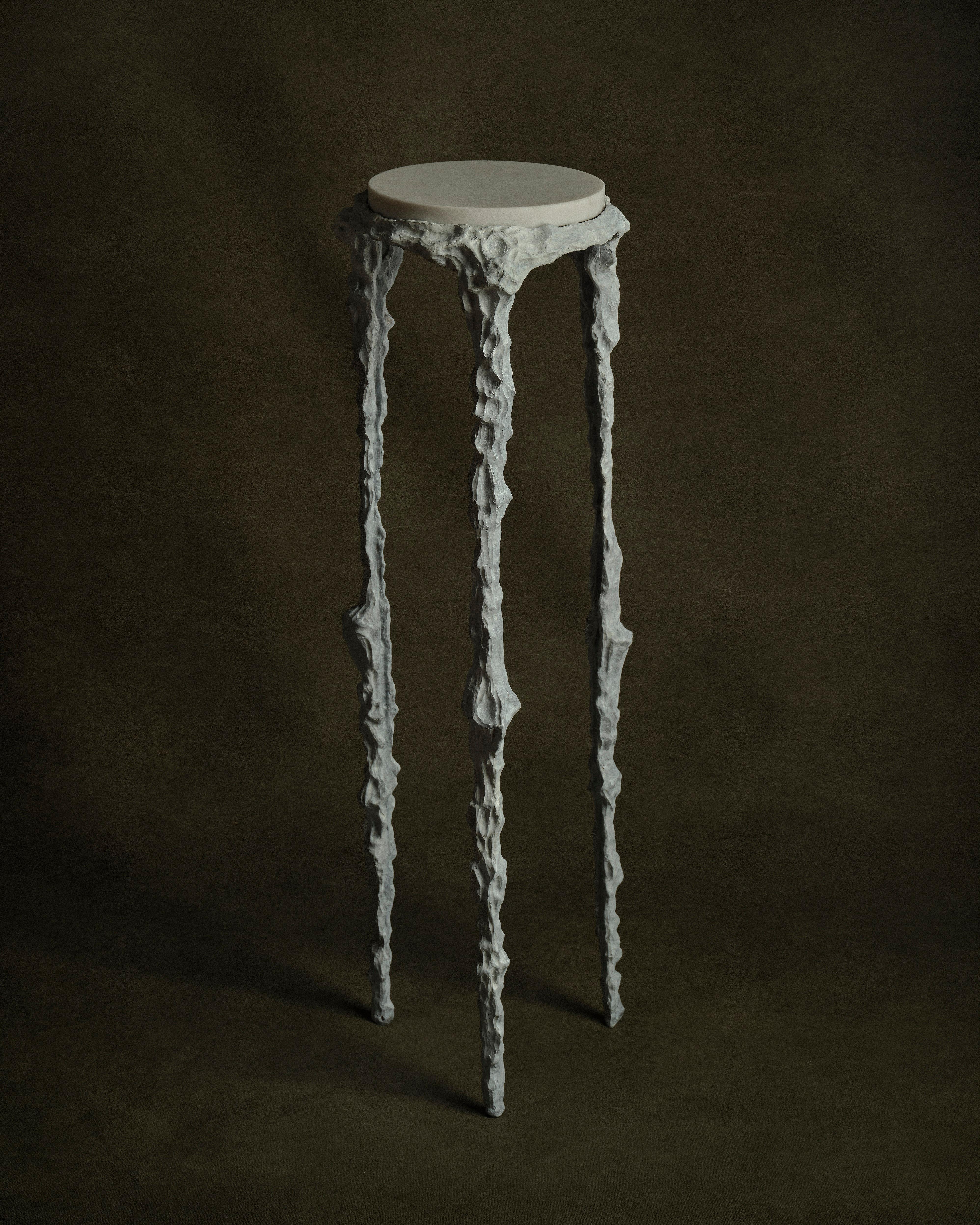 She's Lost Control pedestal table by William Guillon.
One of a Kind
Dimensions: D 29 x H 82 cm
Materials: Matt white patinated gilt bronze structure, white Prinos Greek marble with brushed finish.
Weight: 10 kg


William Guillon

William