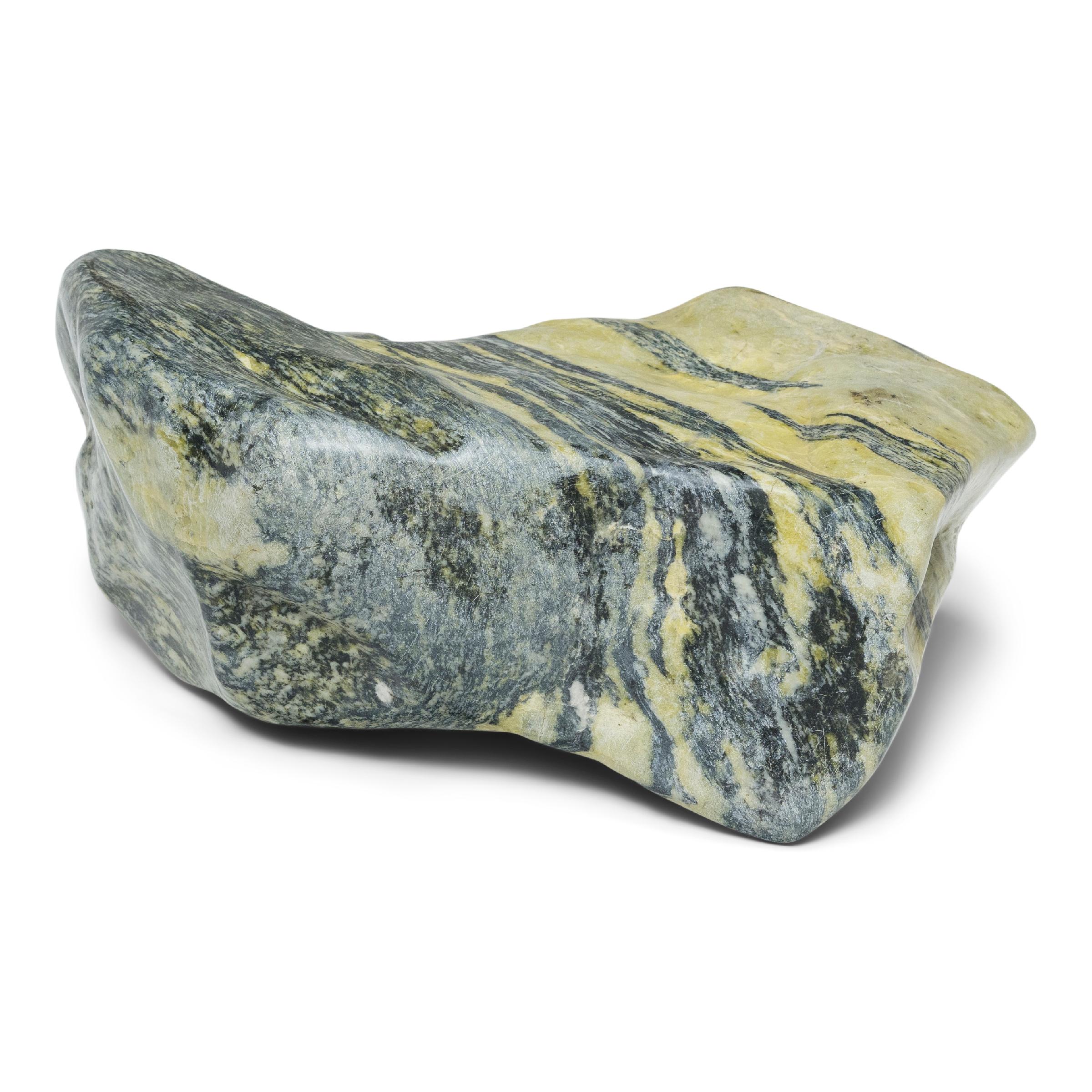 Following the sculpted form, marbled coloring, and natural veining of this one-of-a-kind stone can be deeply meditative. Viewed as a source of beauty and creativity, Chinese scholar-artists would decorate their studios and gardens with similar
