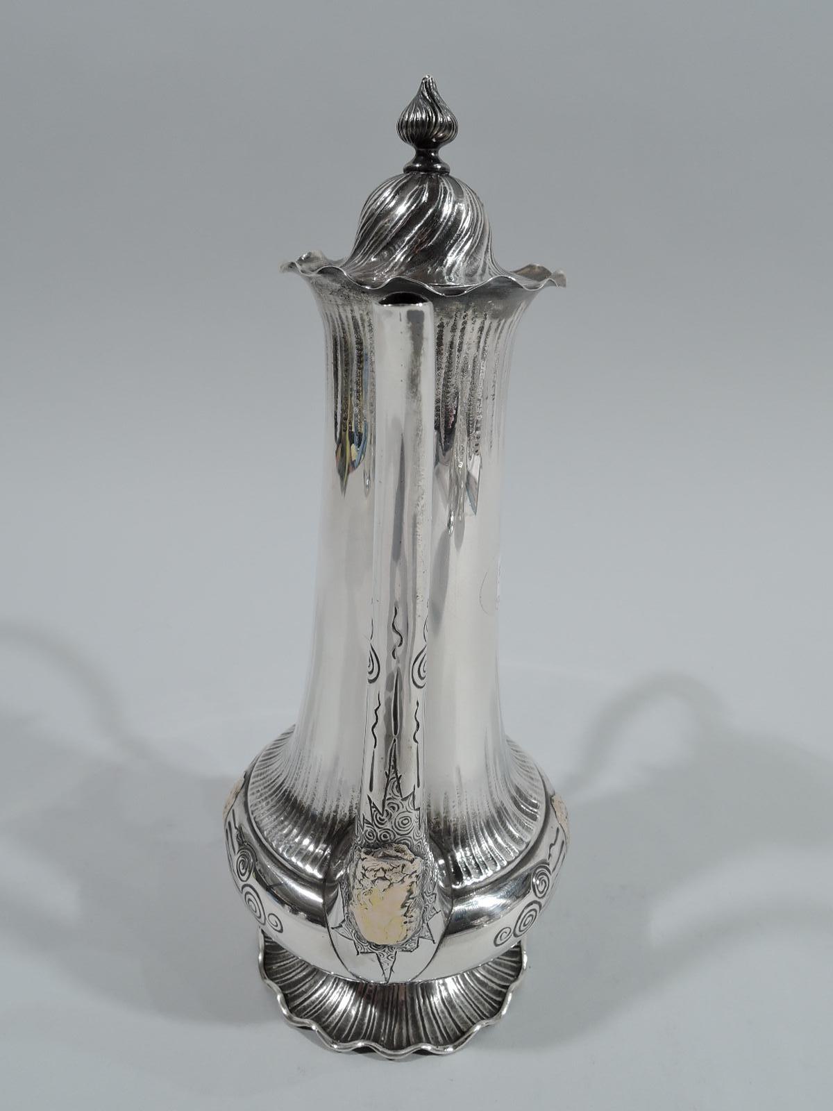 Medallion sterling silver Turkish coffeepot. Made by George W. Shiebler & Co. in New York, ca 1890. Gently upward tapering cylindrical neck flowing into bellied bowl on round and raised foot with wavy rim. Vertical s-scroll spout and high-looping